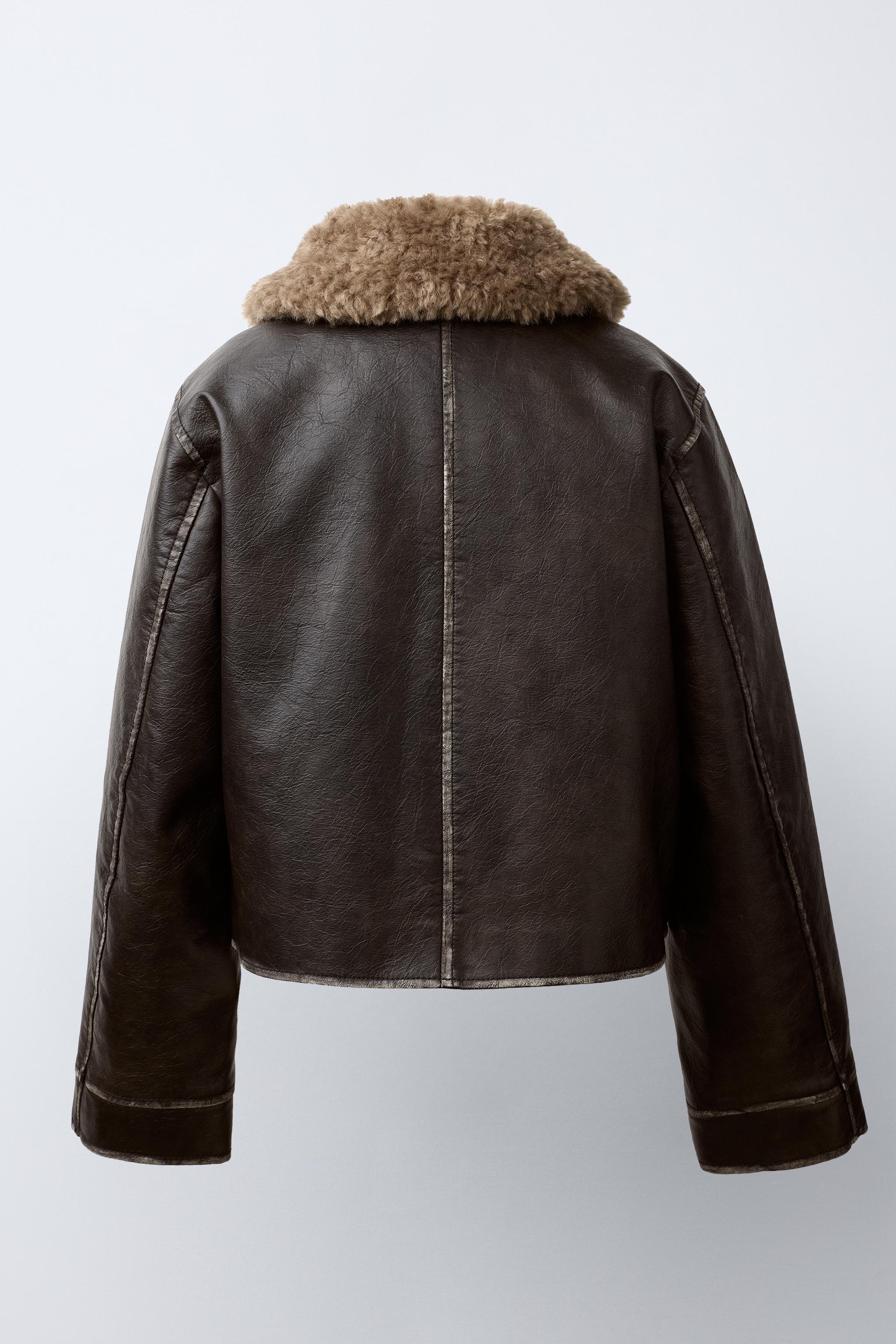 BLOUSON EN MATIÈRE SYNTHÈTIQUE USÉ À COL EFFET FOURRURE