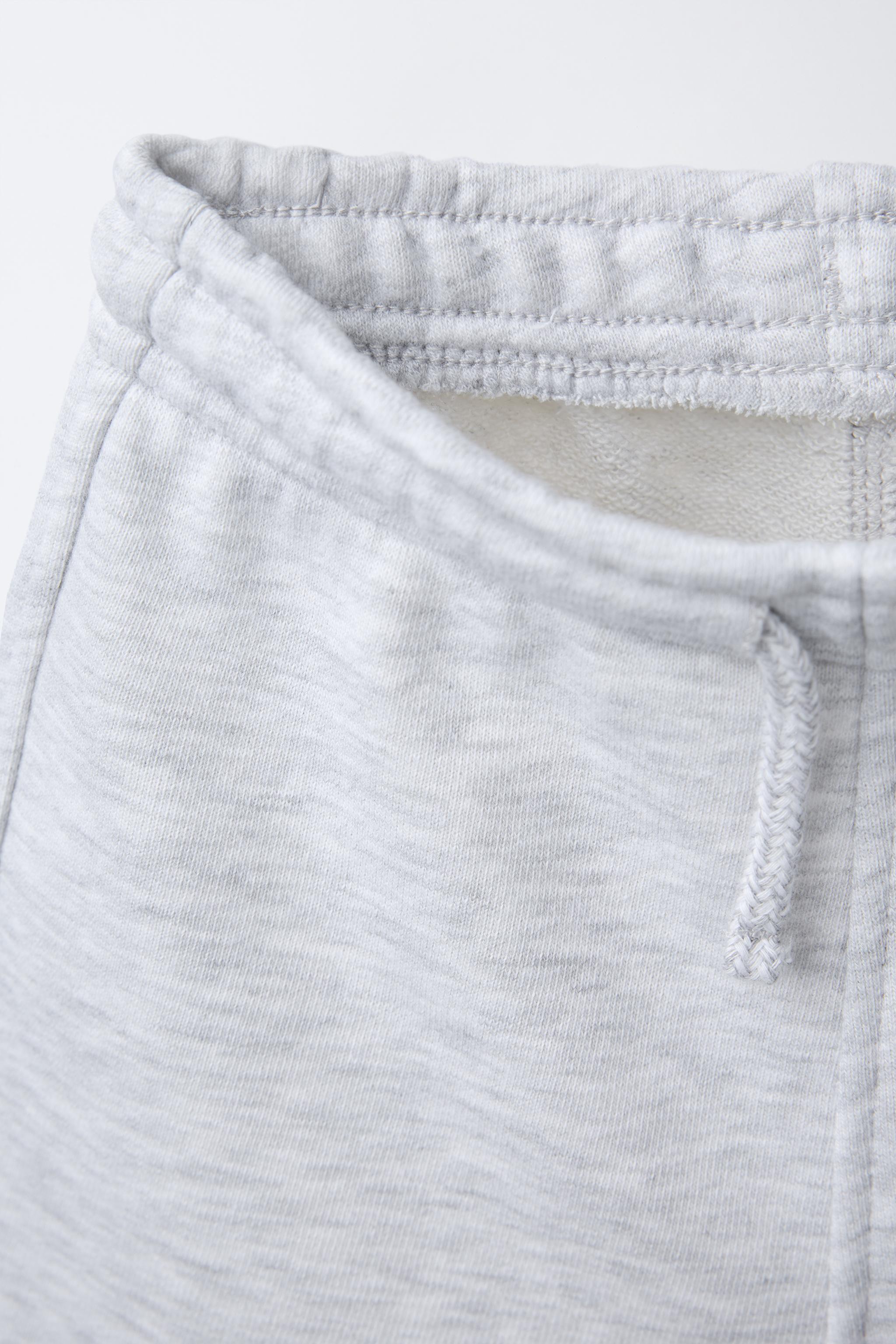 ENSEMBLE DE JOGGING T-SHIRT À INSCRIPTION ET BERMUDA CHINÉ