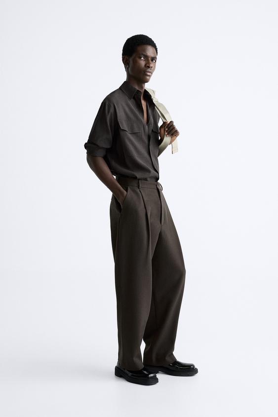 RELAXED FIT PLEATED TROUSERS