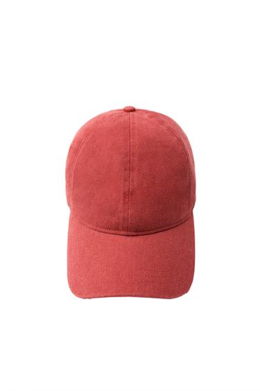 Front view of a red cap with visible stitching.