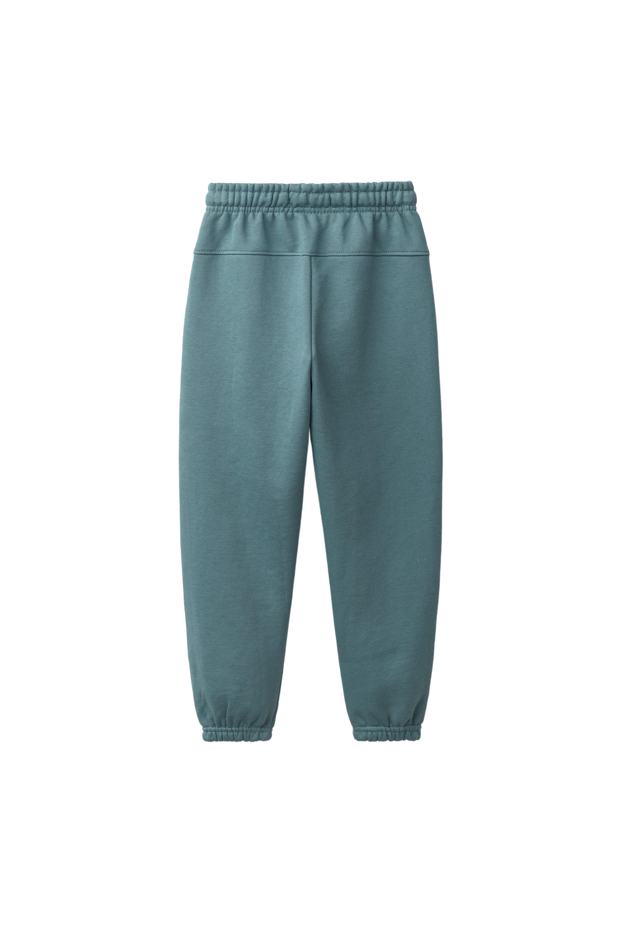 PANTALON DE JOGGING EN MOLLETON UNI AVEC ÉTIQUETTE