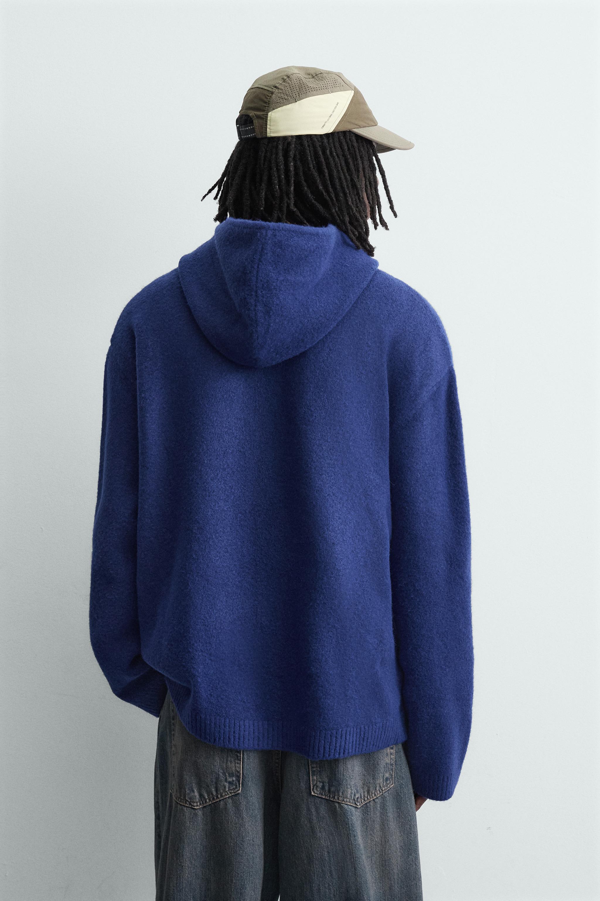 GILET EN MAILLE À CAPUCHE