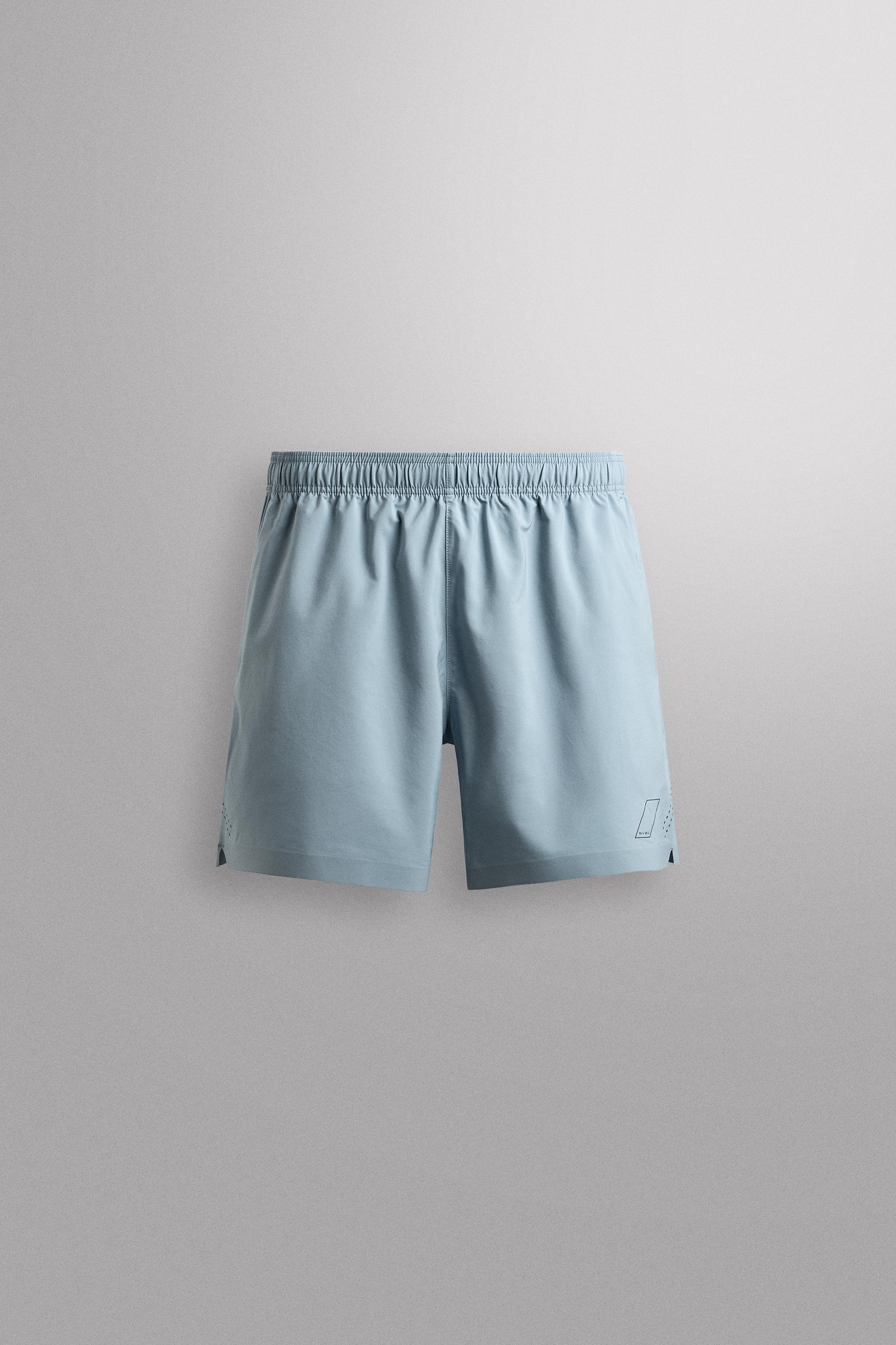 9" TRAINING SHORTS — Light blue