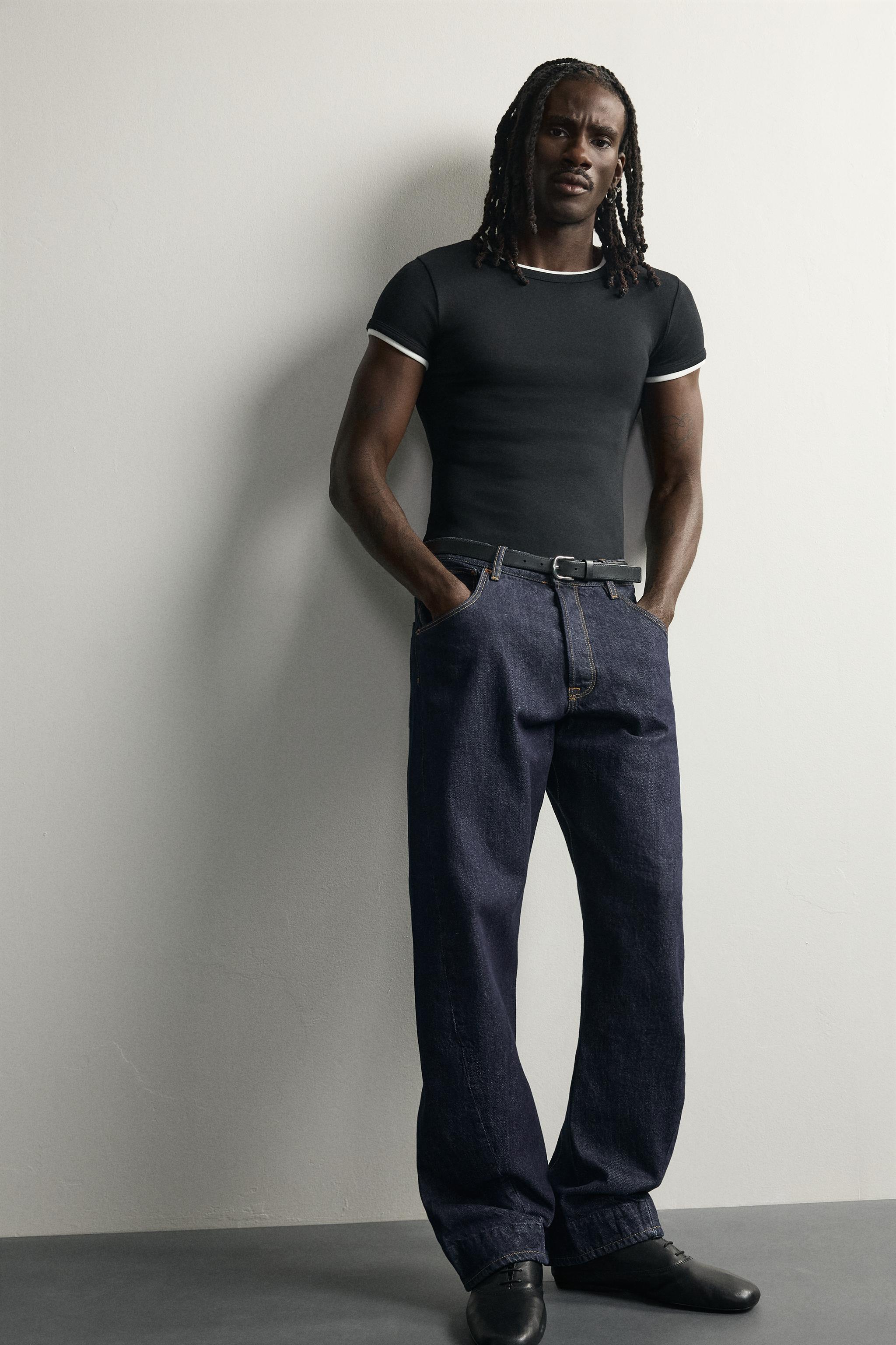 STRAIGHT-FIT JEANS WITH TWISTED SEAMS