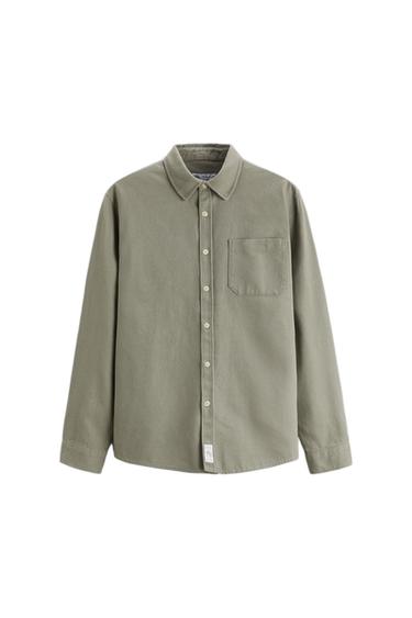 Olive green, long-sleeved shirt with light buttons and a chest pocket, on a white background.