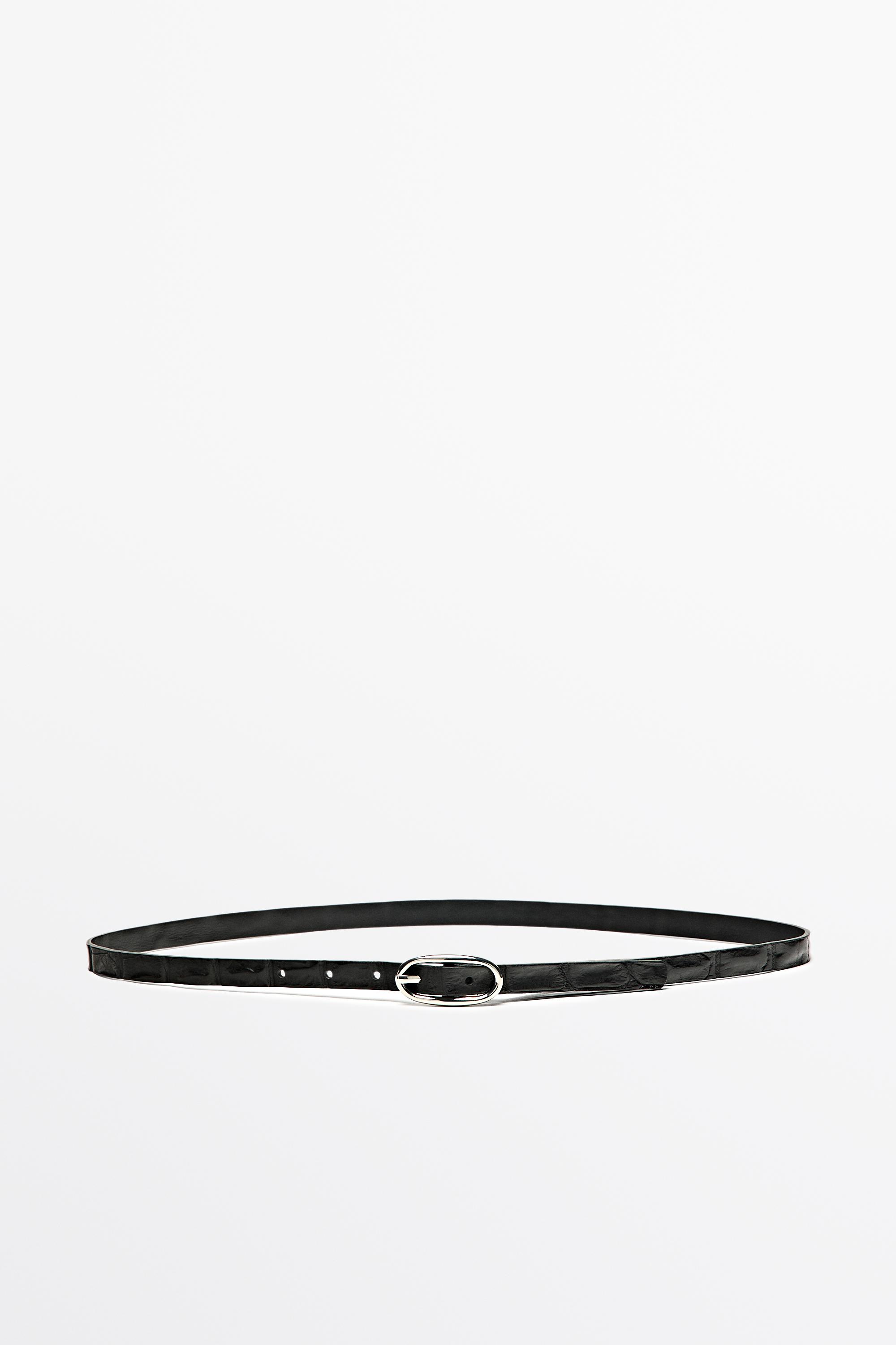 Leather belt with oval buckle and textured finish