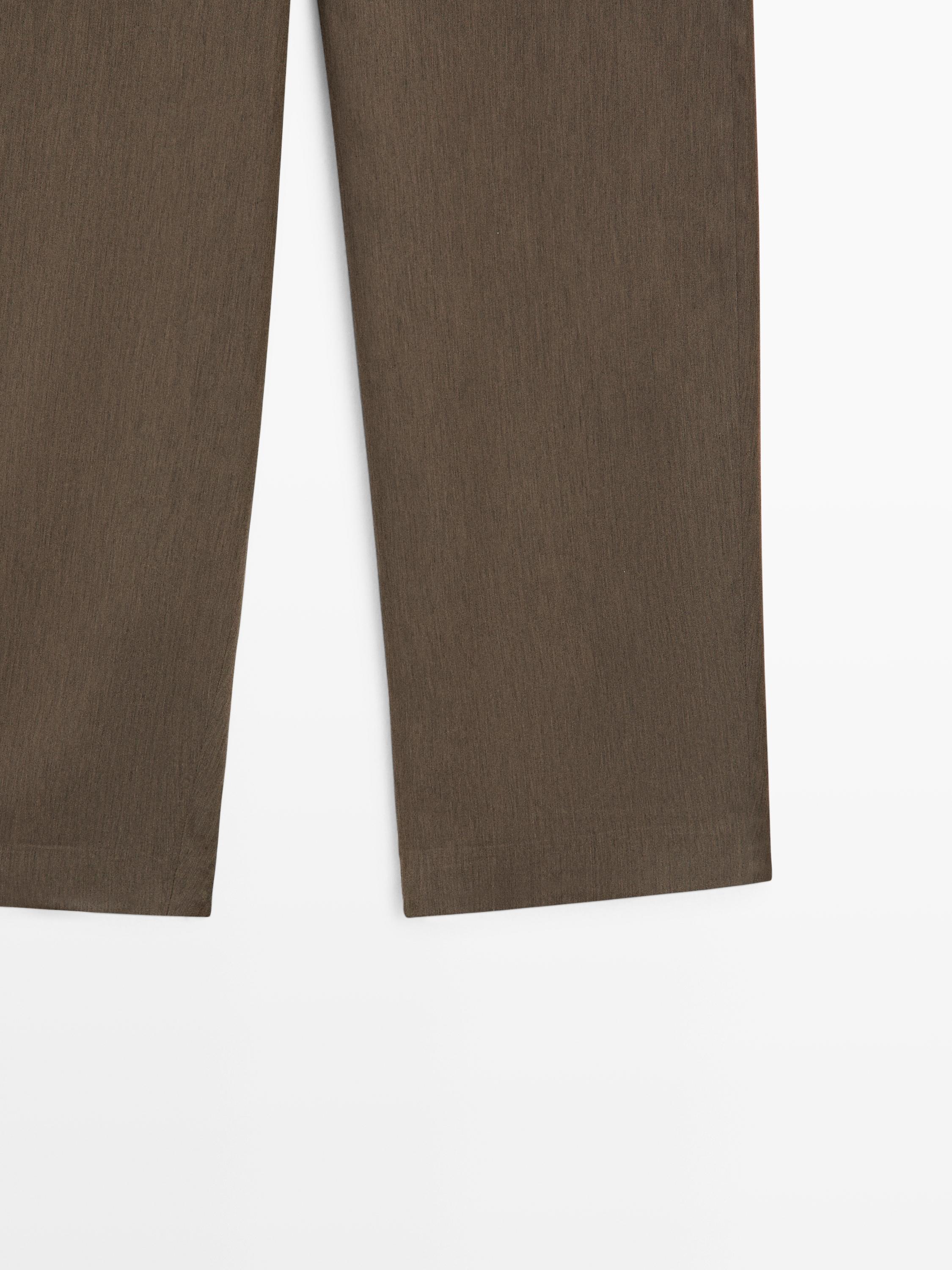 Flowing trousers with elasticated waistband