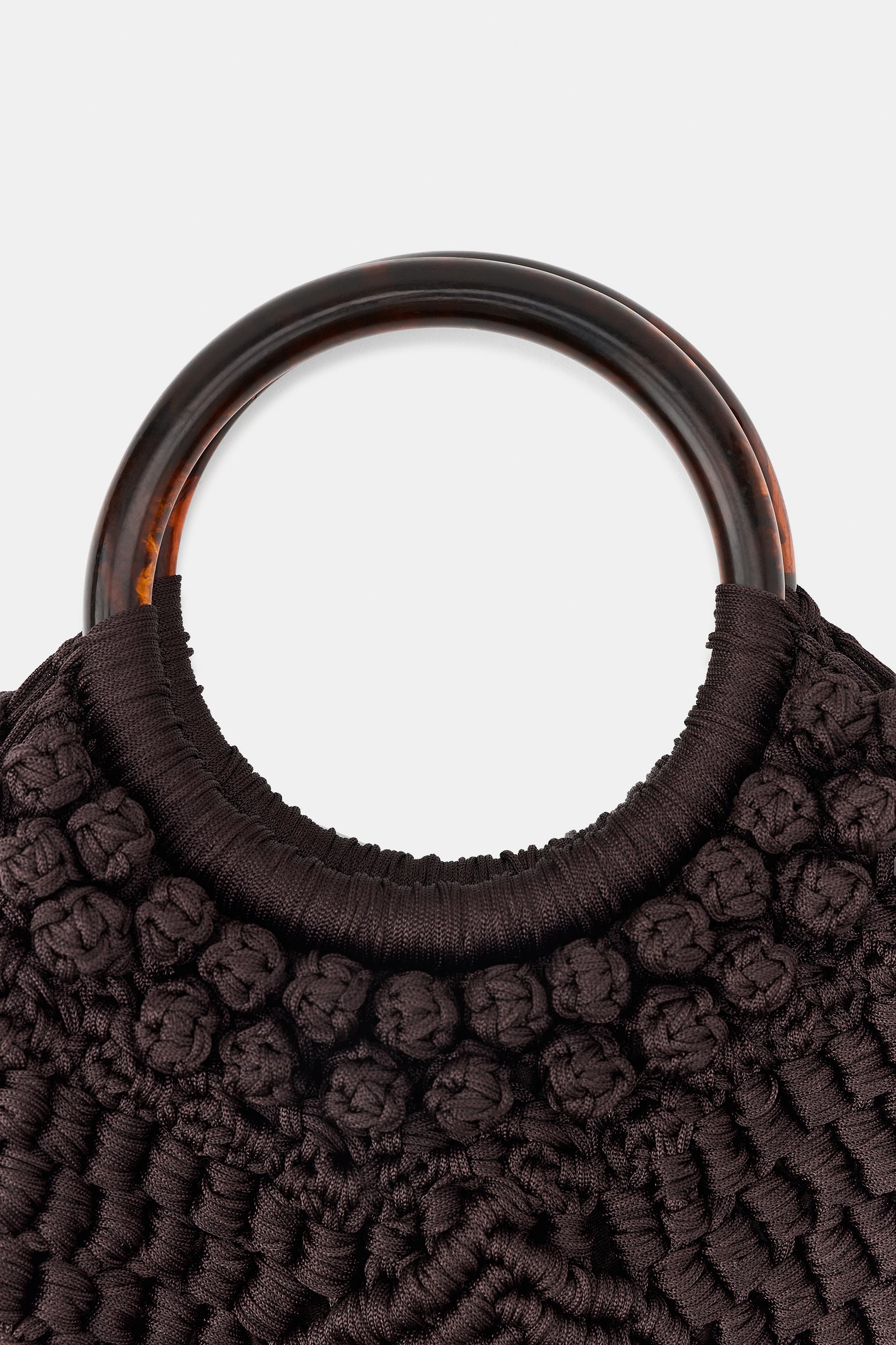 SAC EN TISSU À NŒUDS ET FRANGES
