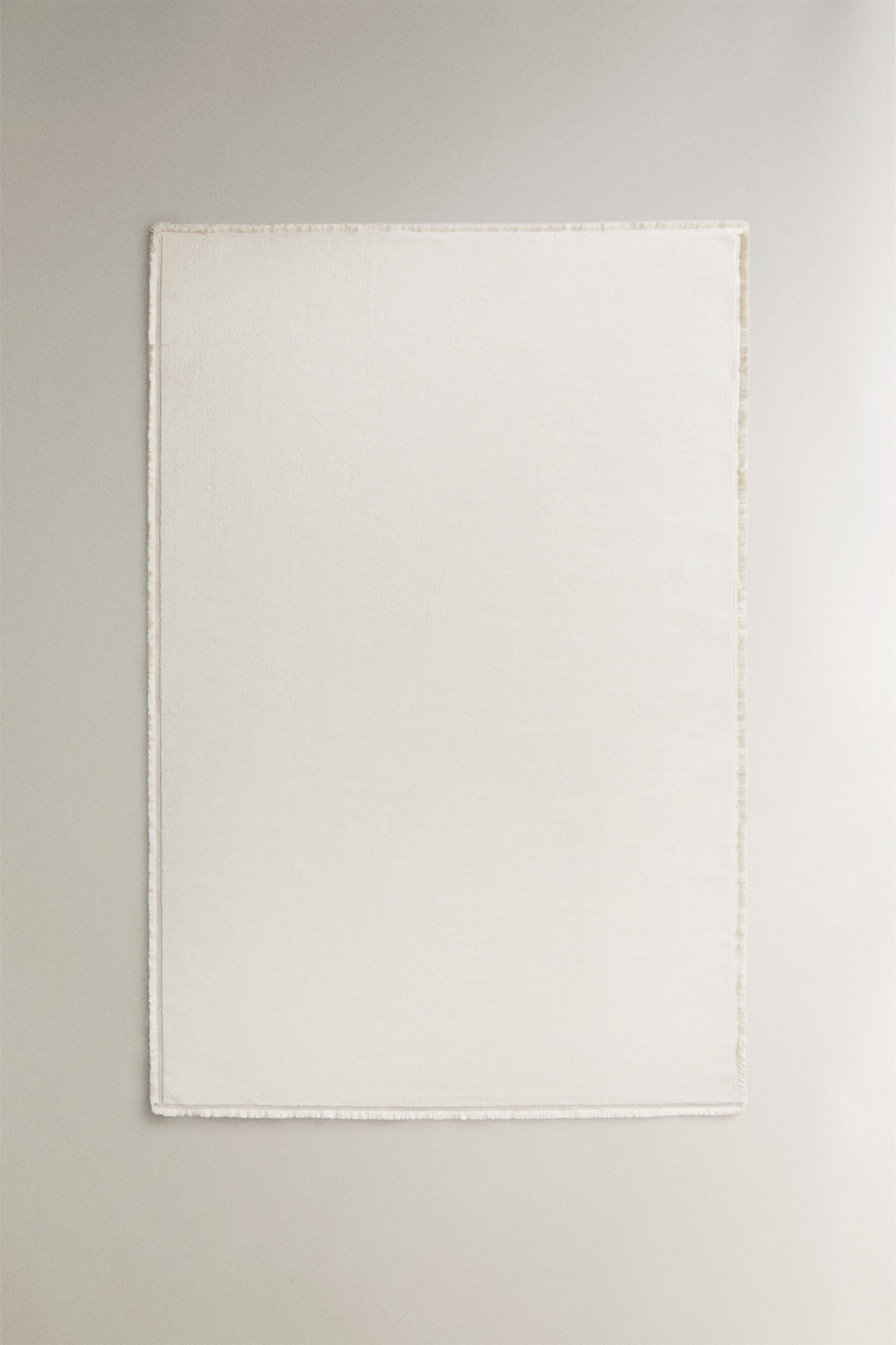 FRINGED AREA RUG — Oyster-white