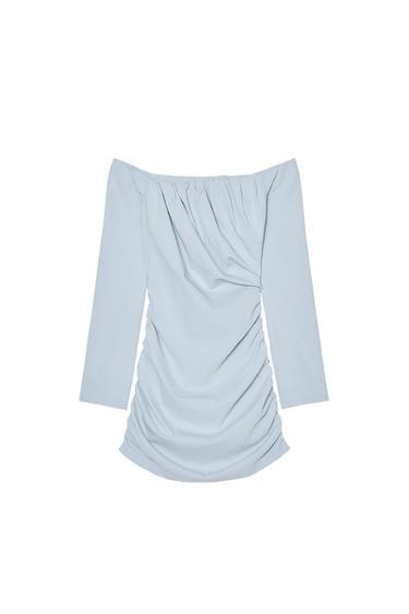 Front view of a light blue, off-the-shoulder blouse with ruching at the front.