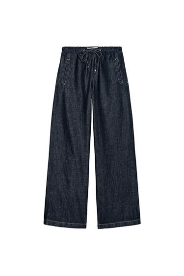 Front view of dark blue pants with adjustable drawstring and side pockets.