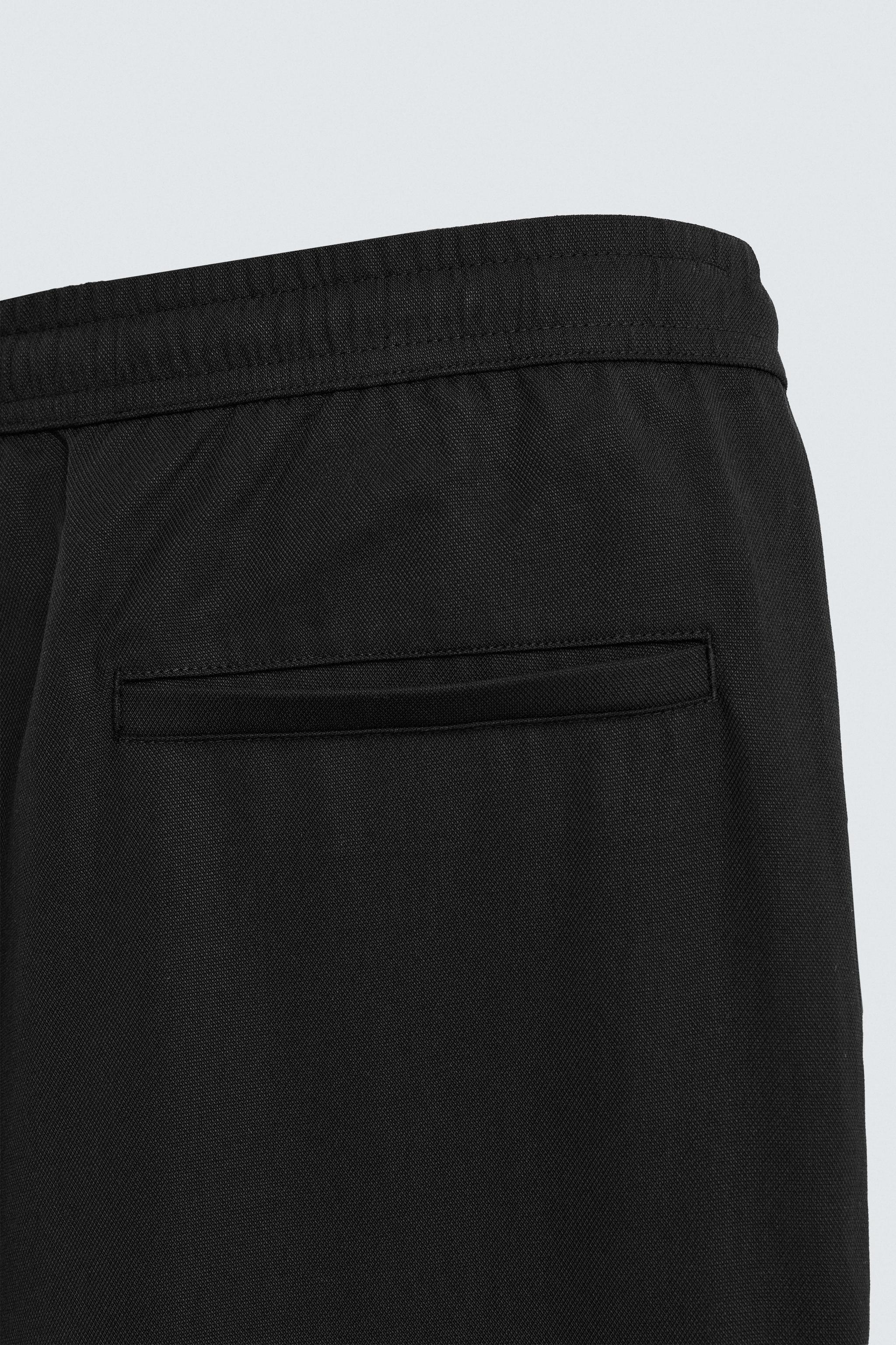 RELAXED FIT FLOWY PANTS