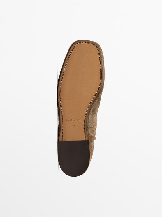 Split suede loafers with fringing