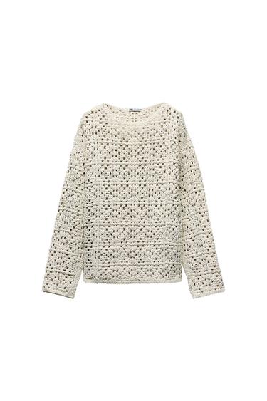 Front view of a white cable-knit crew neck long-sleeved sweater.