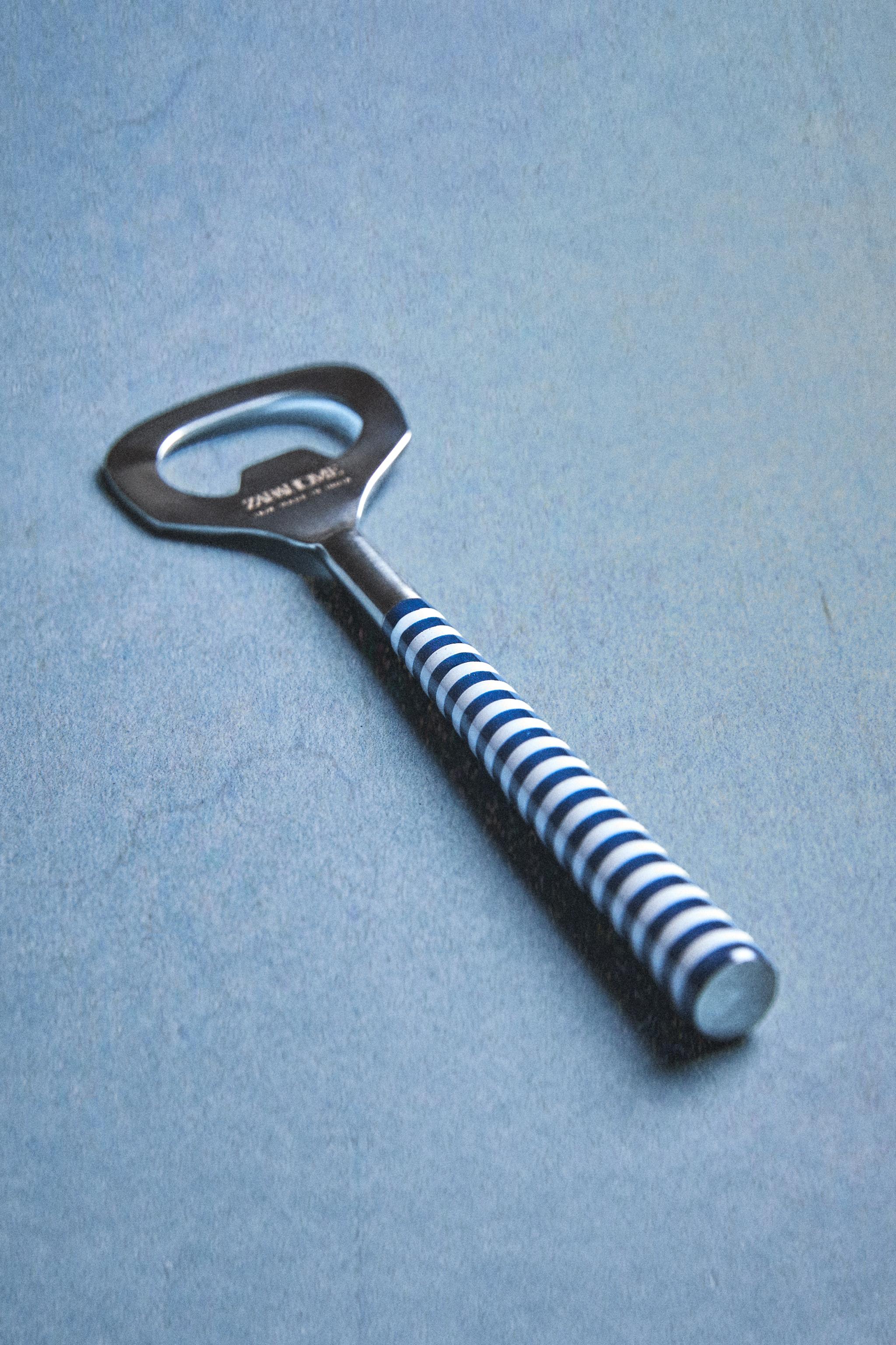 BOTTLE OPENER WITH STRIPED HANDLE