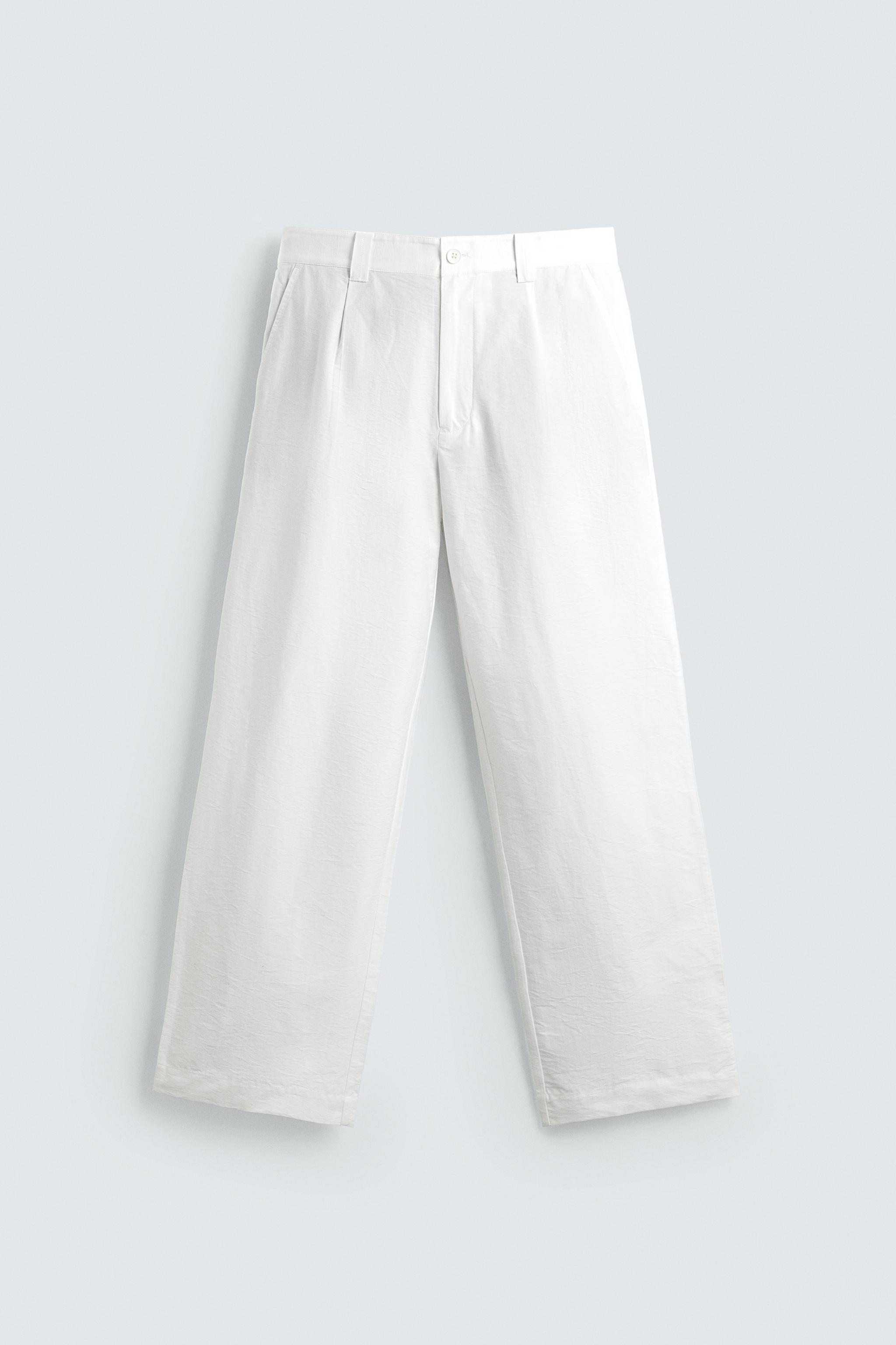 PANTALON COUPE LARGE À PLIS