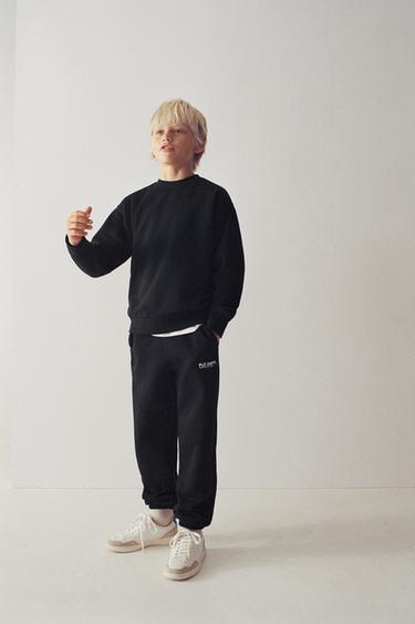 سترة بيزيك بكتابة - أسود by Zara