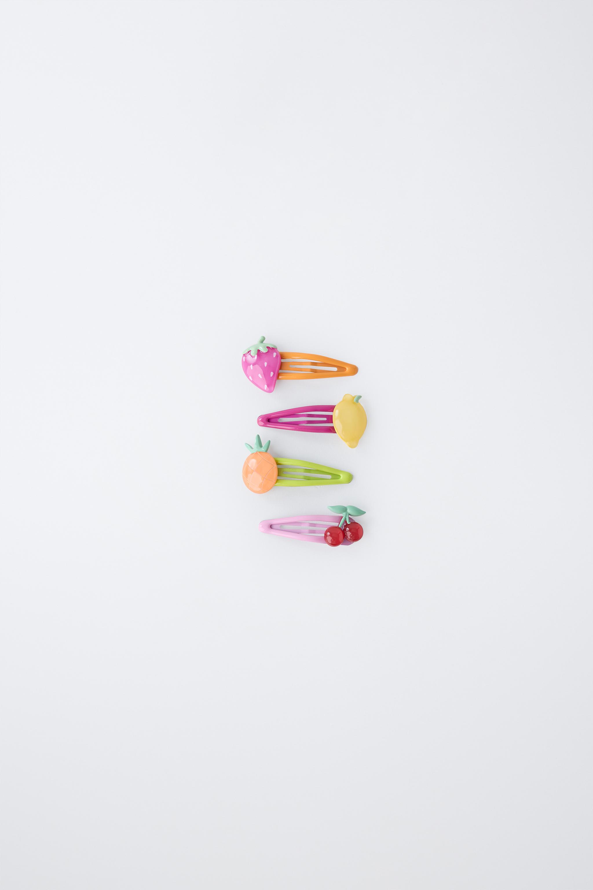 LOT DE QUATRE PINCES FRUITS