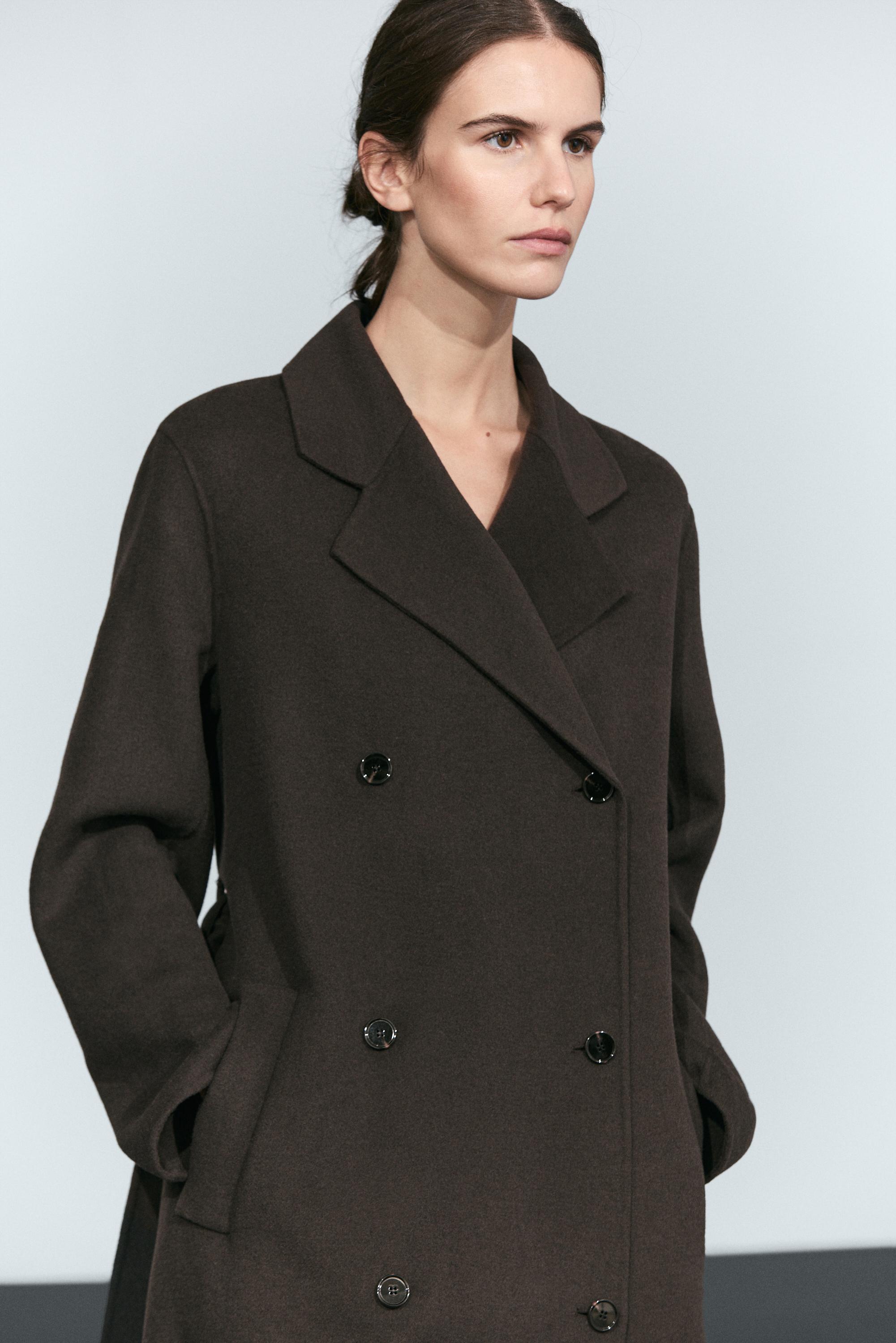 Manteau long croisé détail ceinture