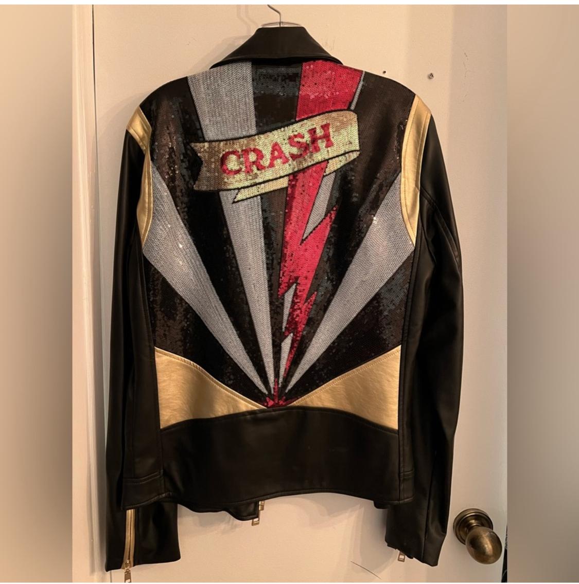 Rear view of black jacket with lightning bolt design and 'CRASH' text in sequins.