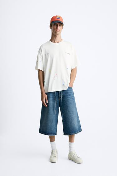 ФУТБОЛКА С ПРИНТОМ «БРЫЗГИ КРАСКИ» И НАДПИСЯМИ — БЕЛЫЙ от Zara — изображение 0