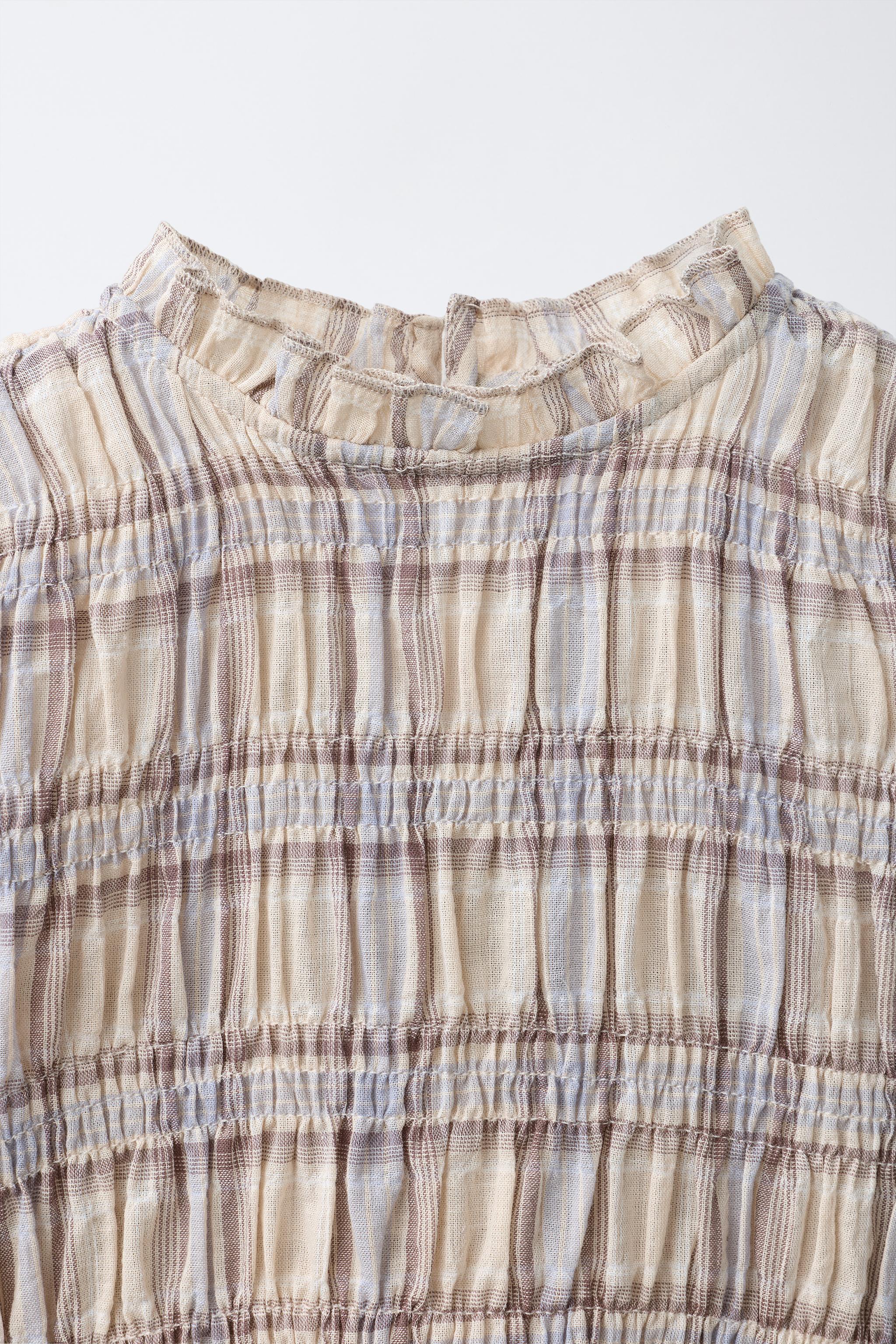 CHEMISE À CARREAUX ET ÉLASTIQUES