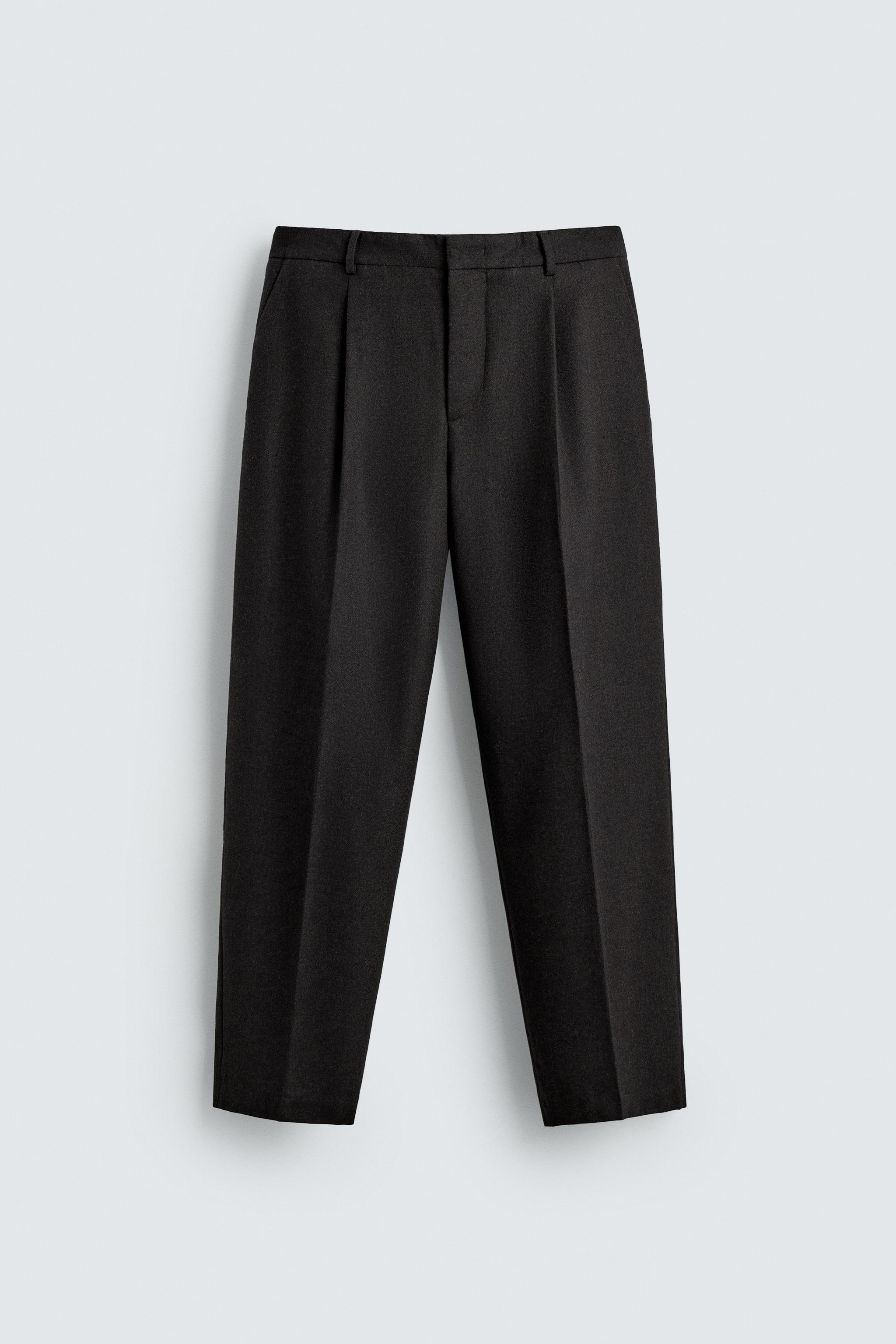 LIMITED EDITION PLEATED WOOL PANTS