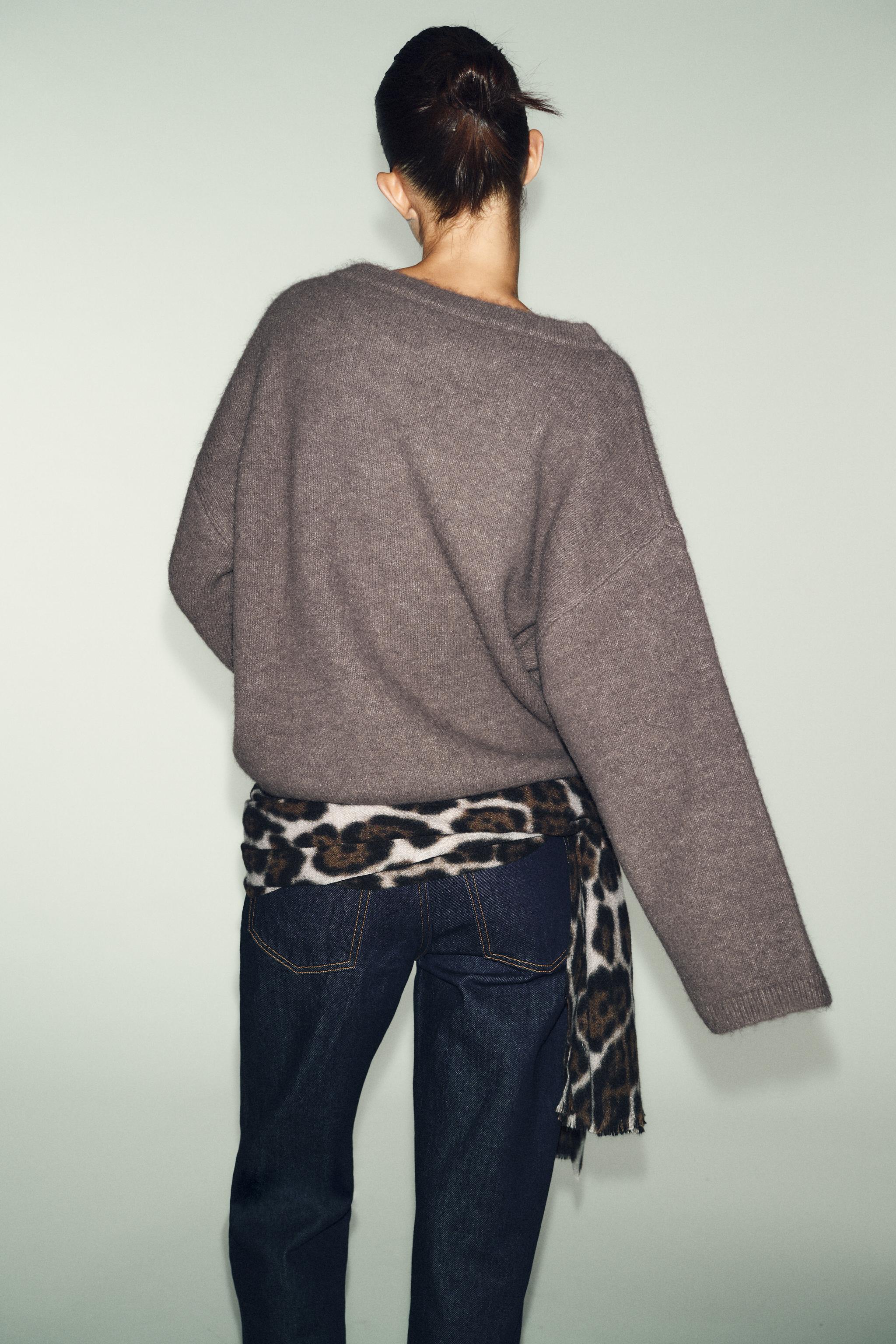 PULL EN MAILLE AVEC FERMOIR