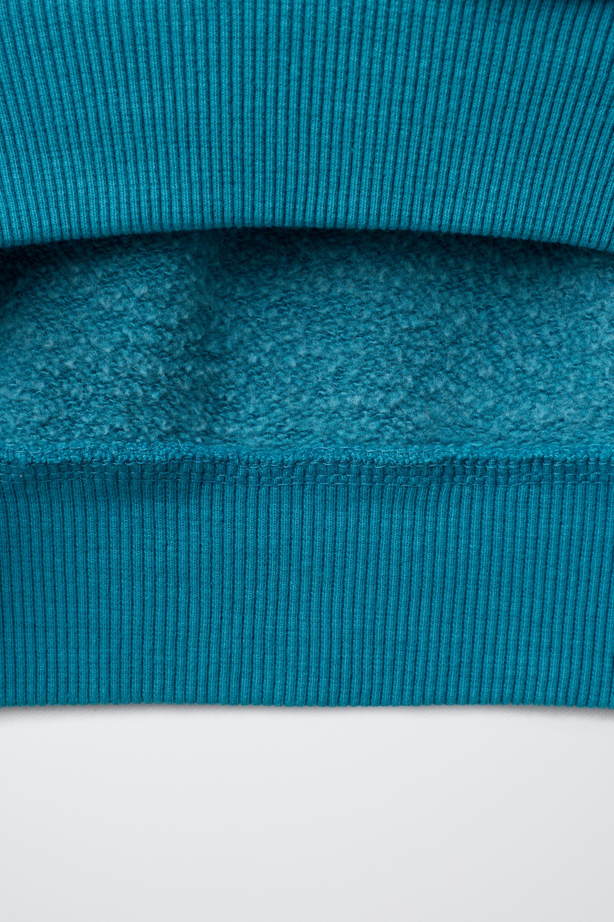 SWEAT EFFET DÉLAVÉ IMPRIMÉ
