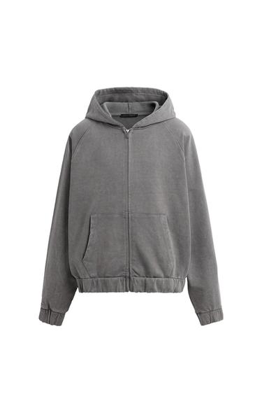 Front view of grey hoodie with hood and front pockets.