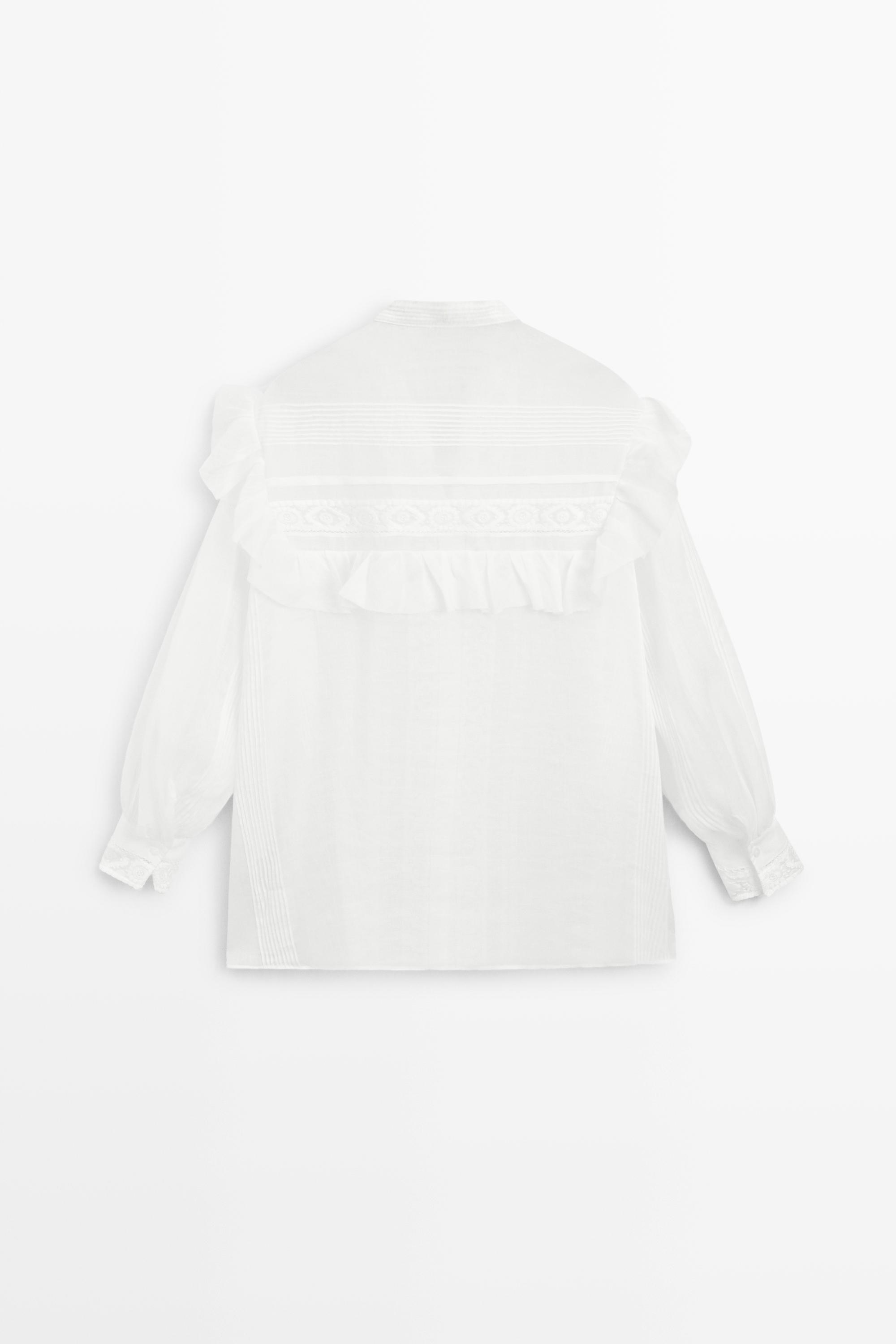 Stand collar blouse with embroidery and ruffles