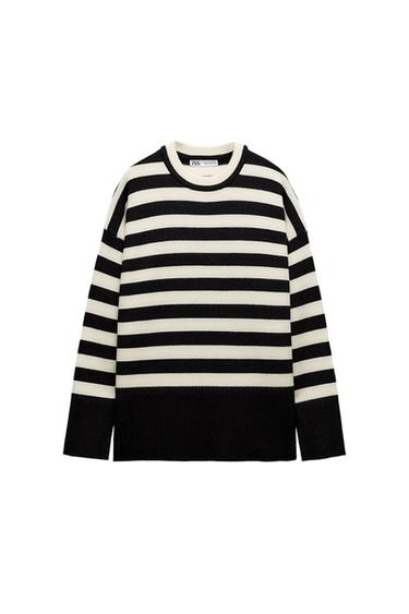 Black and white horizontal striped sweater on a white background. Round neck and long sleeves. Visible tag inside.