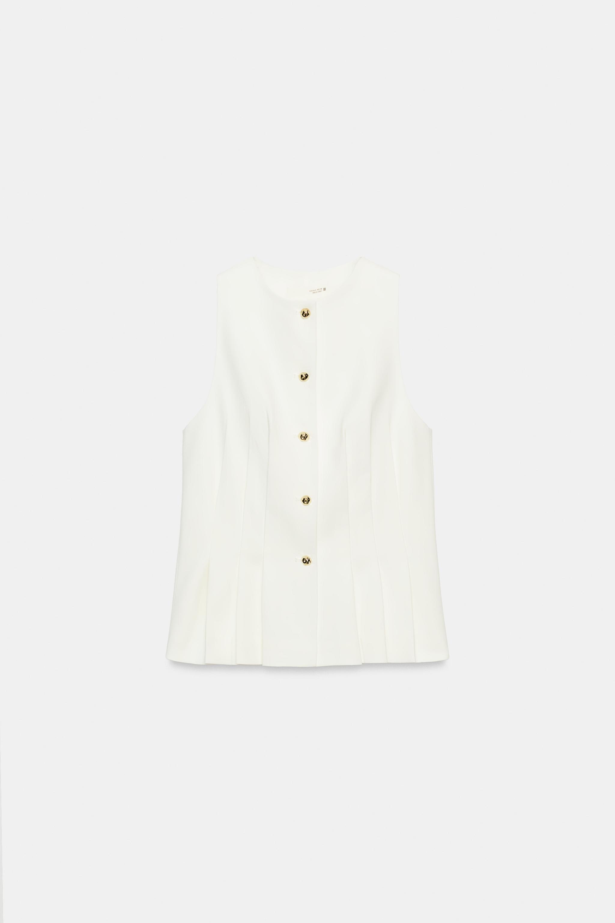 GILET À PINCES