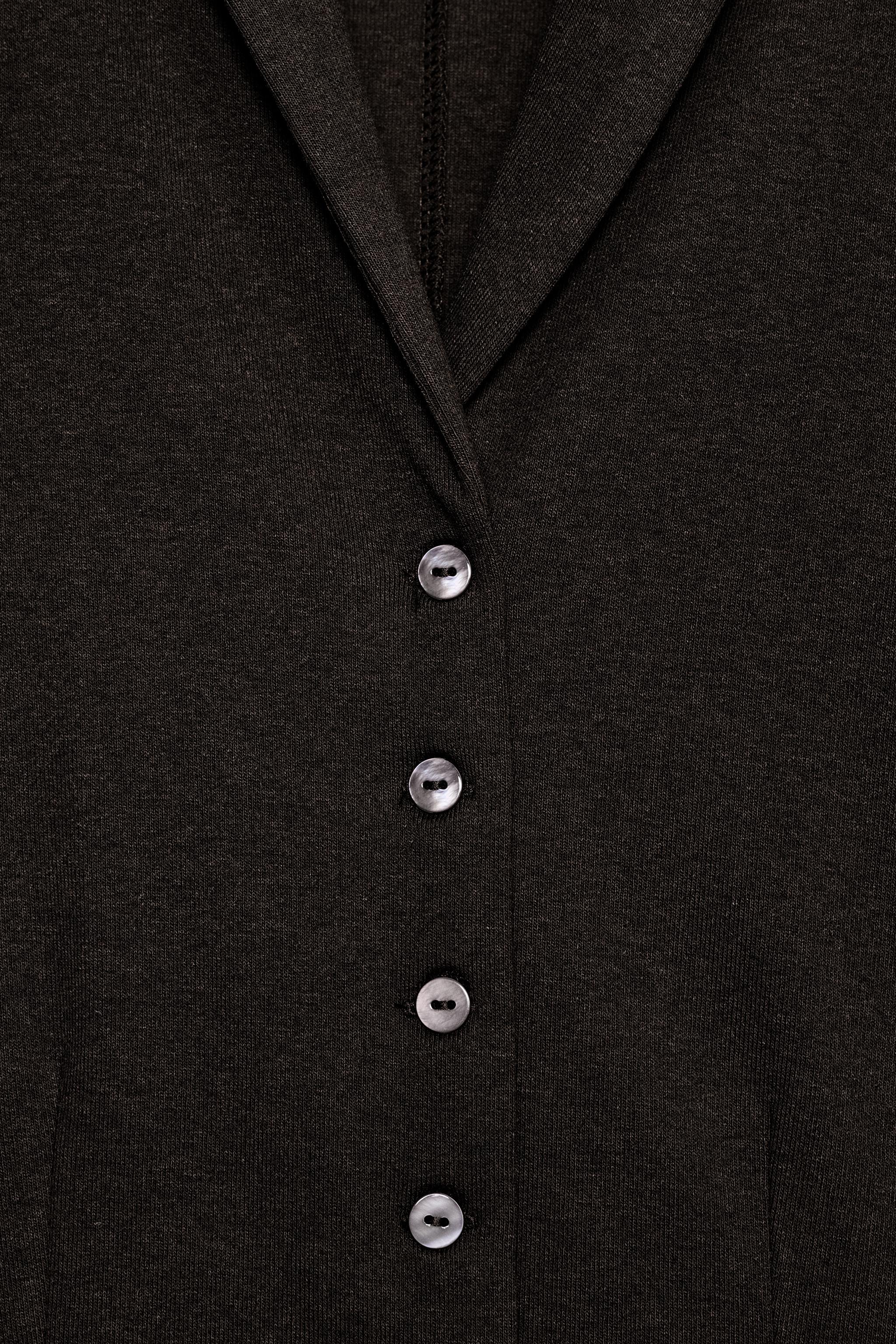 VESTE COURTE BOUTONNÉE