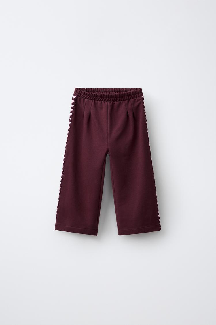 PANTALÓN FELPA WIDE LEG BANDAS CORAZONES