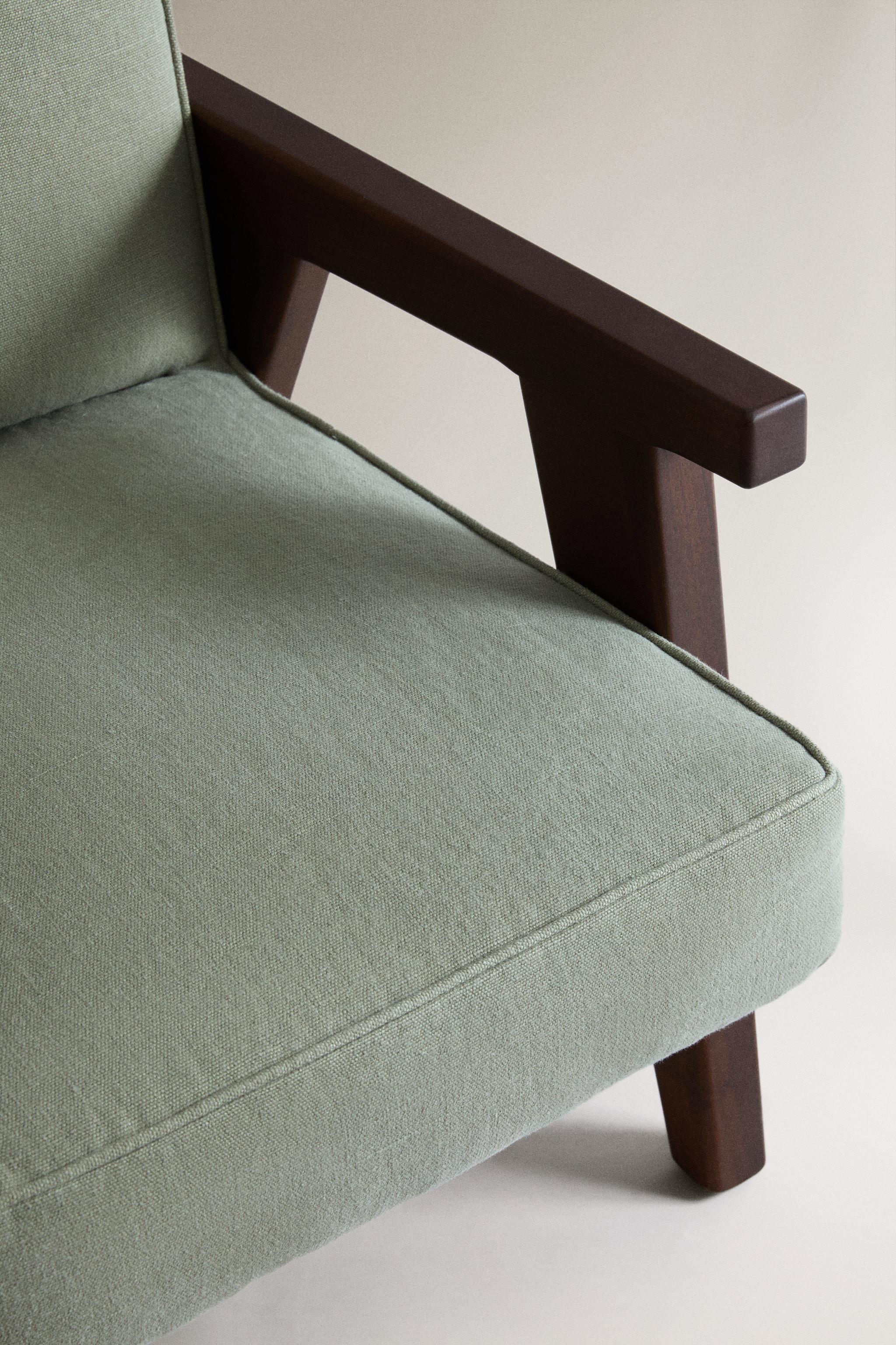 WALNUT WOOD AND LINEN ARMCHAIR — Light green