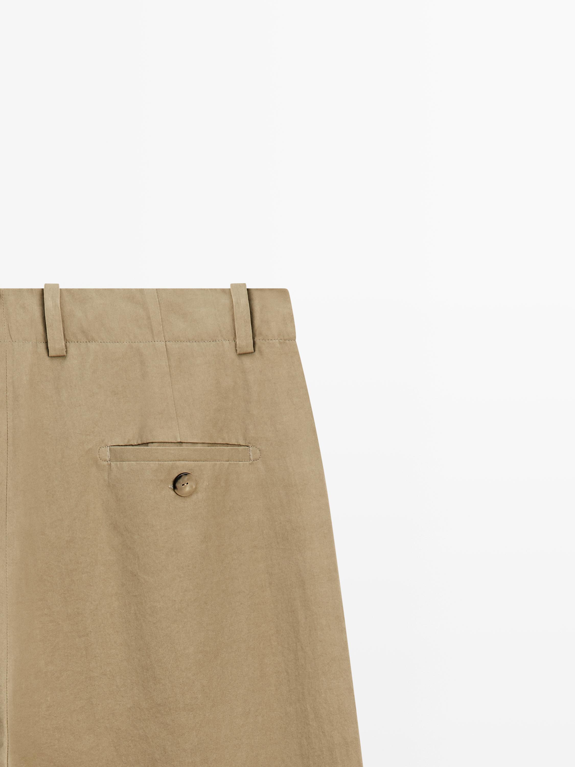Pantalon à plis avec fermeture croisée - STUDIO