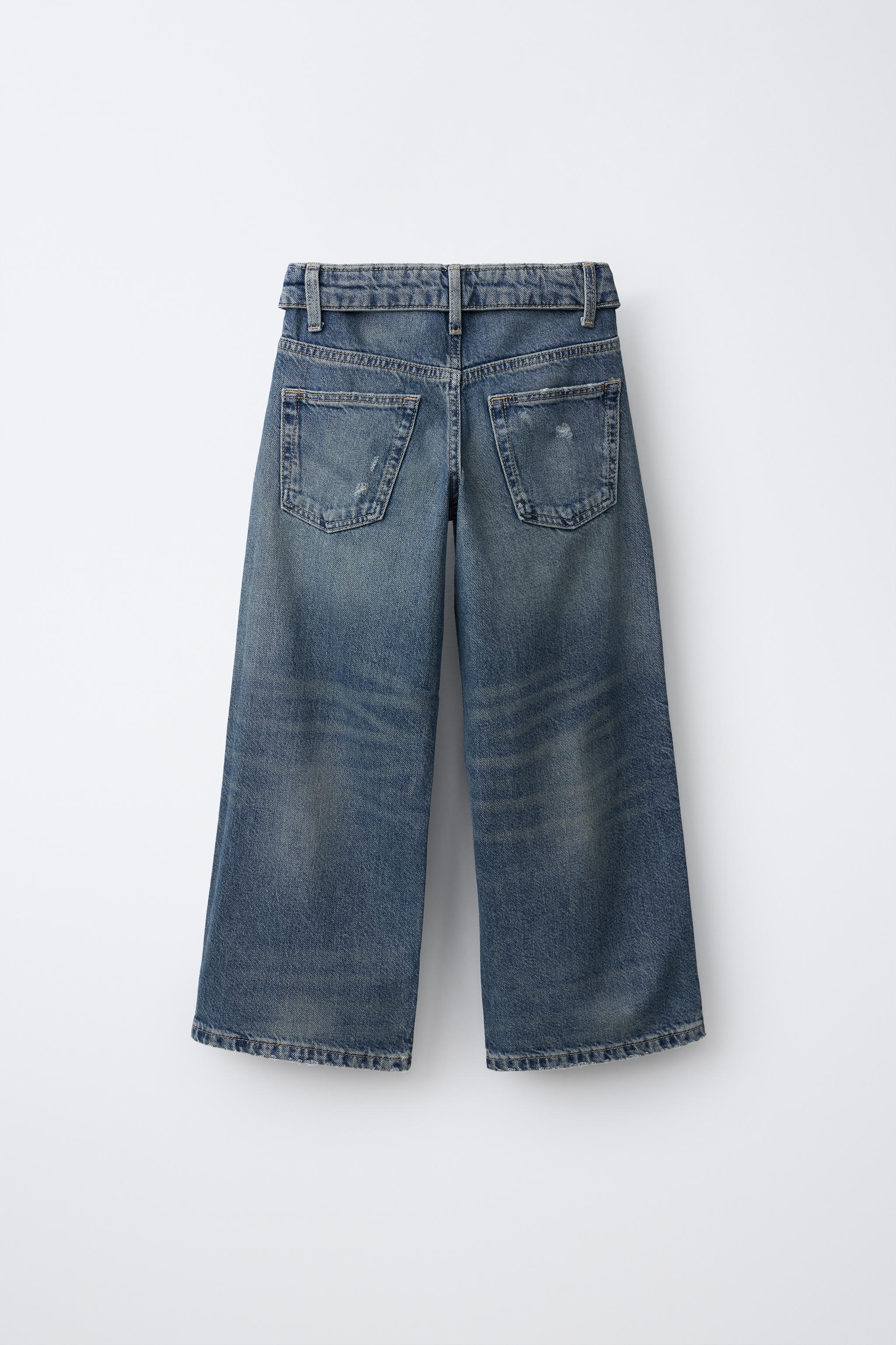 JEAN À JAMBES LARGES DÉCHIRÉ