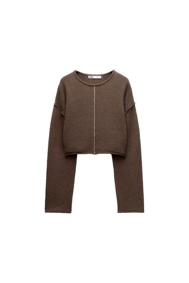 Front view of a brown cropped jumper with a visible centre seam.