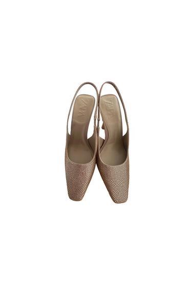Beige slingback heeled shoes with a sparkly dot texture. Insole with the "ZARA" brand visible.
