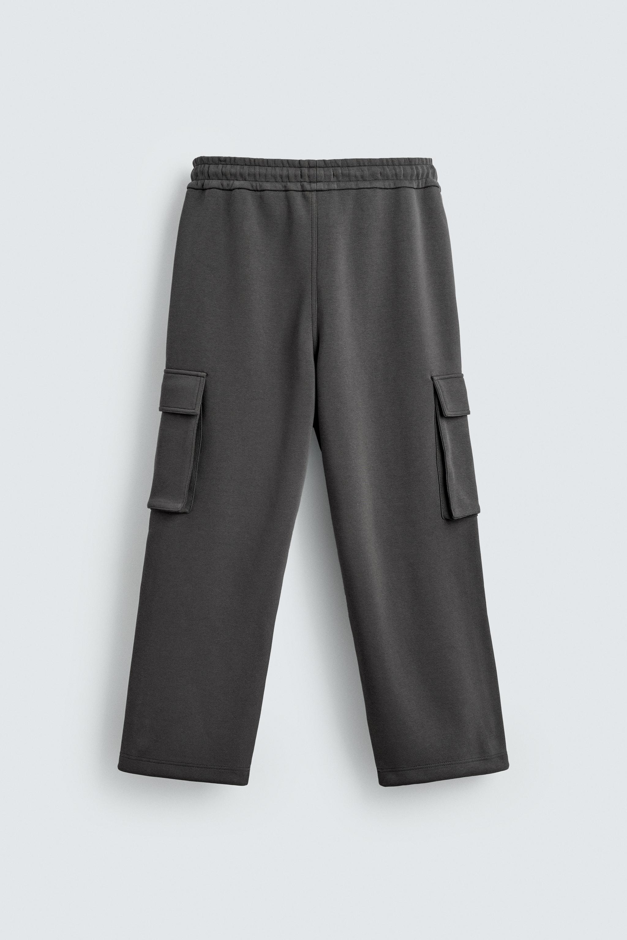 NEOPRENE EFFECT CARGO PANTS WITH PLEATS