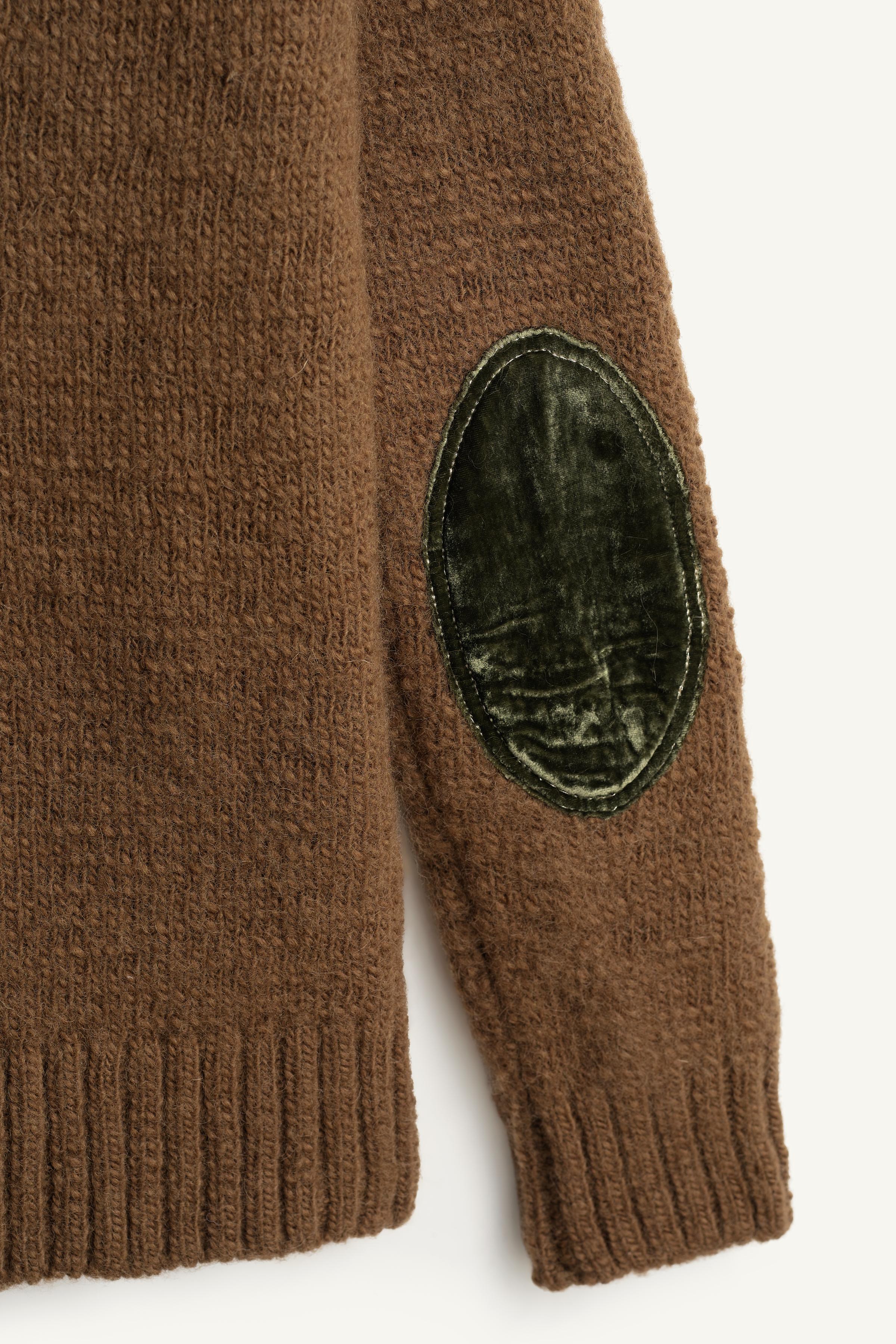 LIMITED EDITION WOOL SWEATER WITH BROOCH