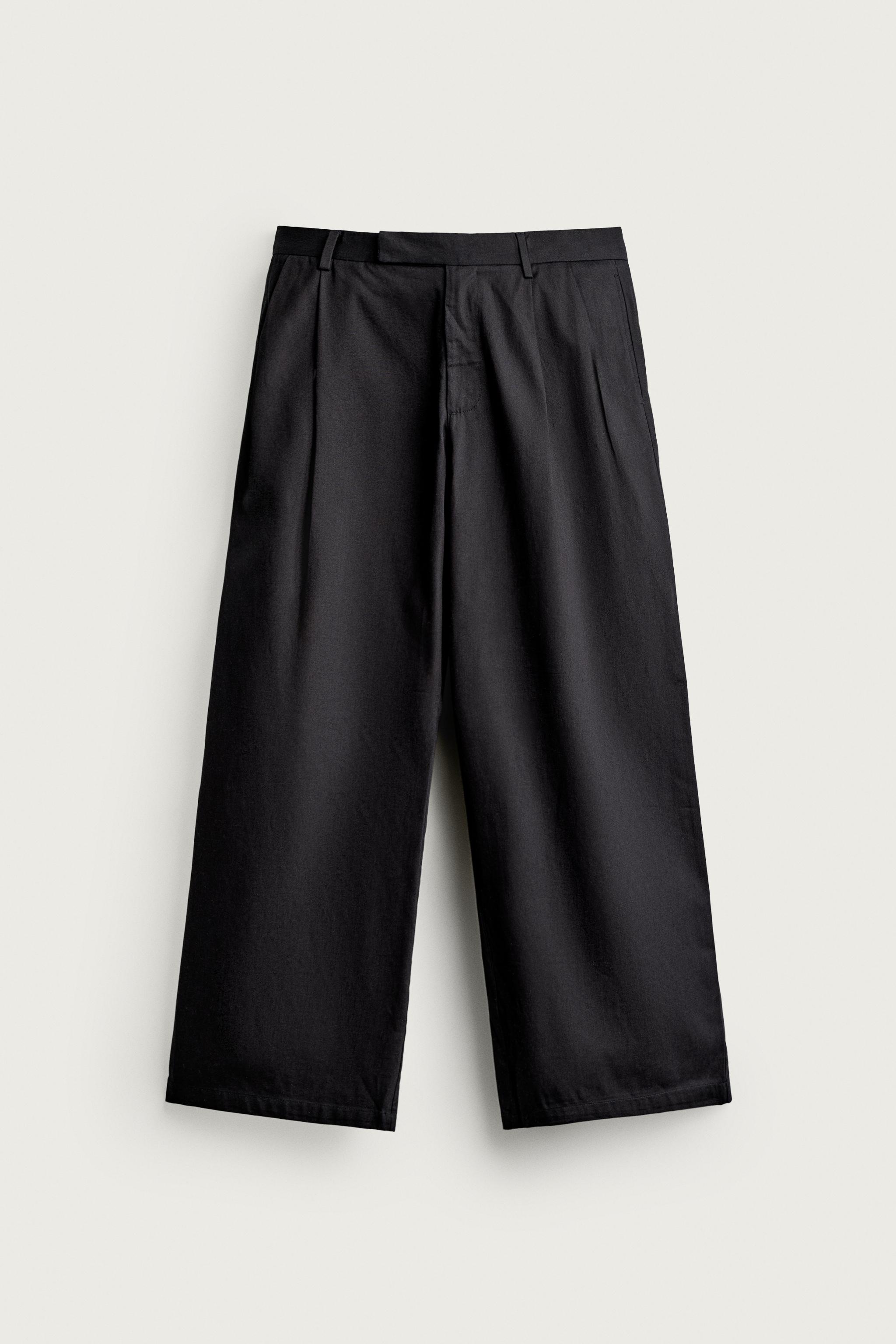 RELAXED-FIT PLEATED TROUSERS
