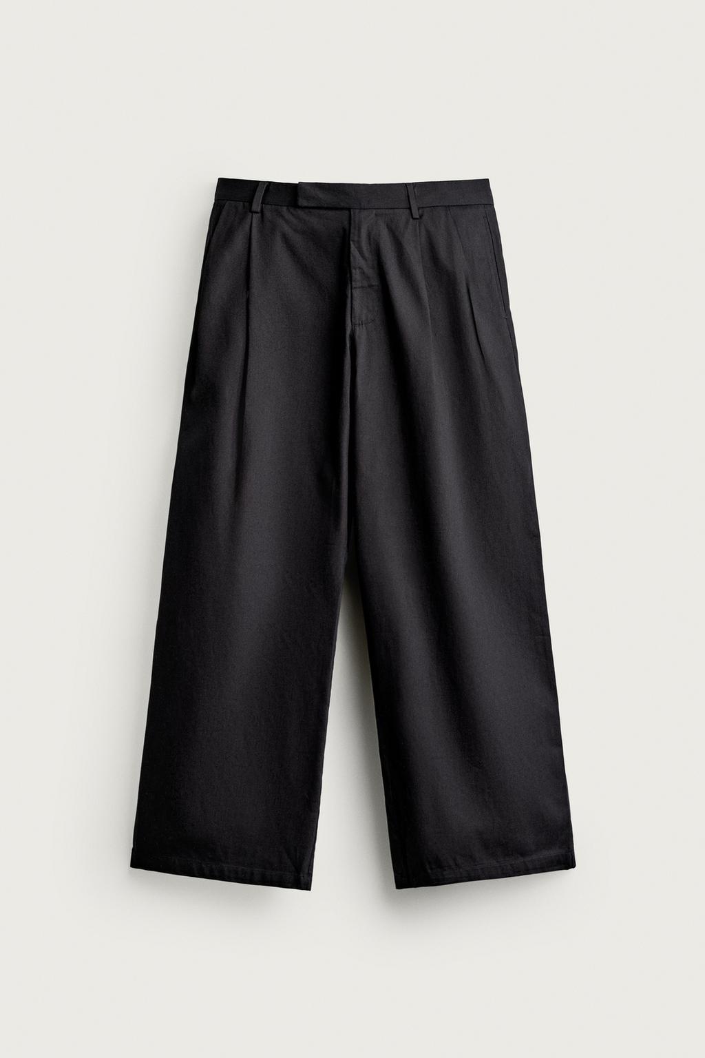 RELAXED FIT PLEATED TROUSERS