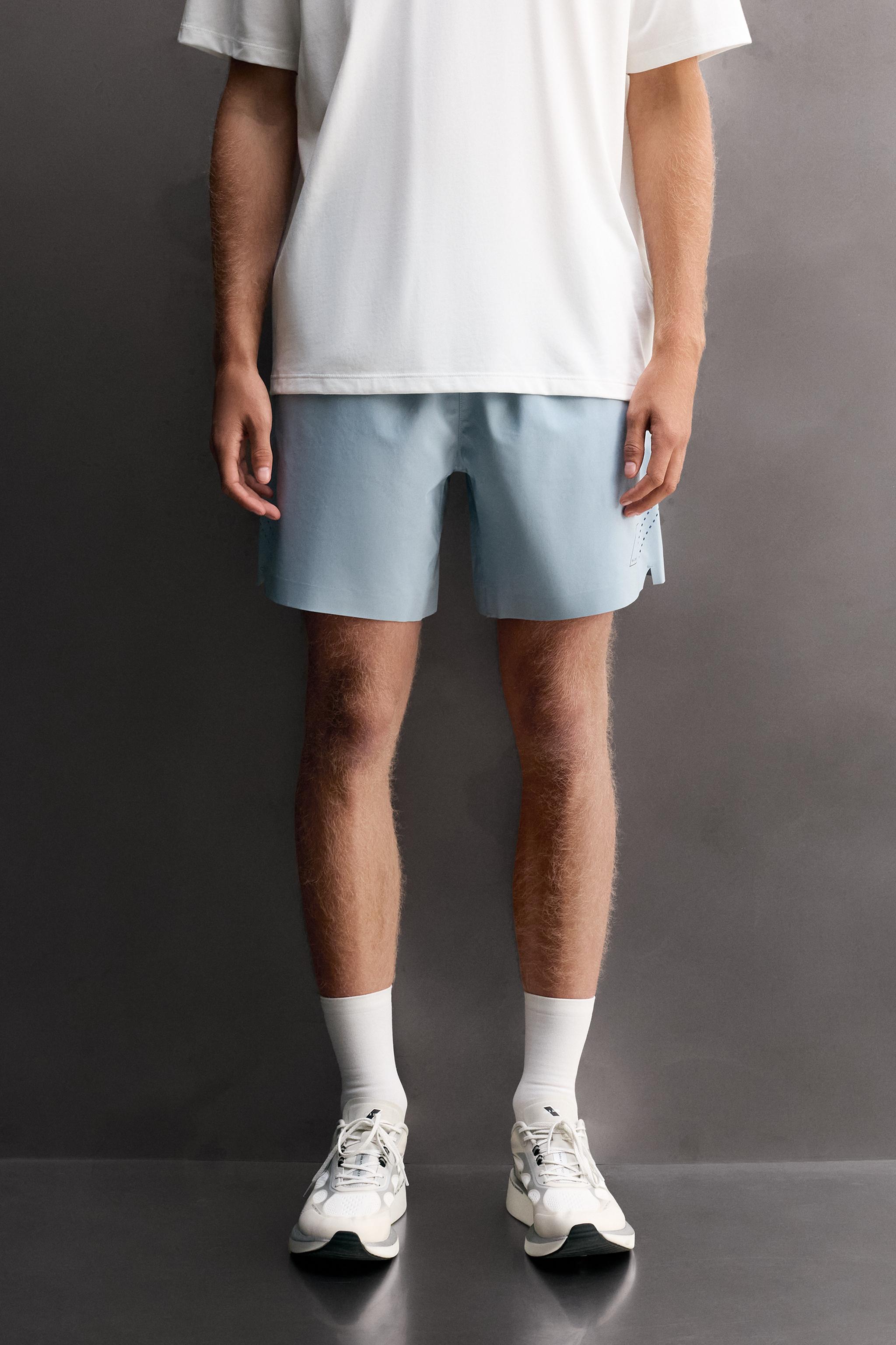 9" TRAINING SHORTS — Light blue