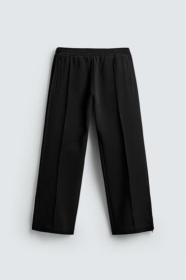 מכנסיים נשפכים עם רוכסנים - שחור של Zara