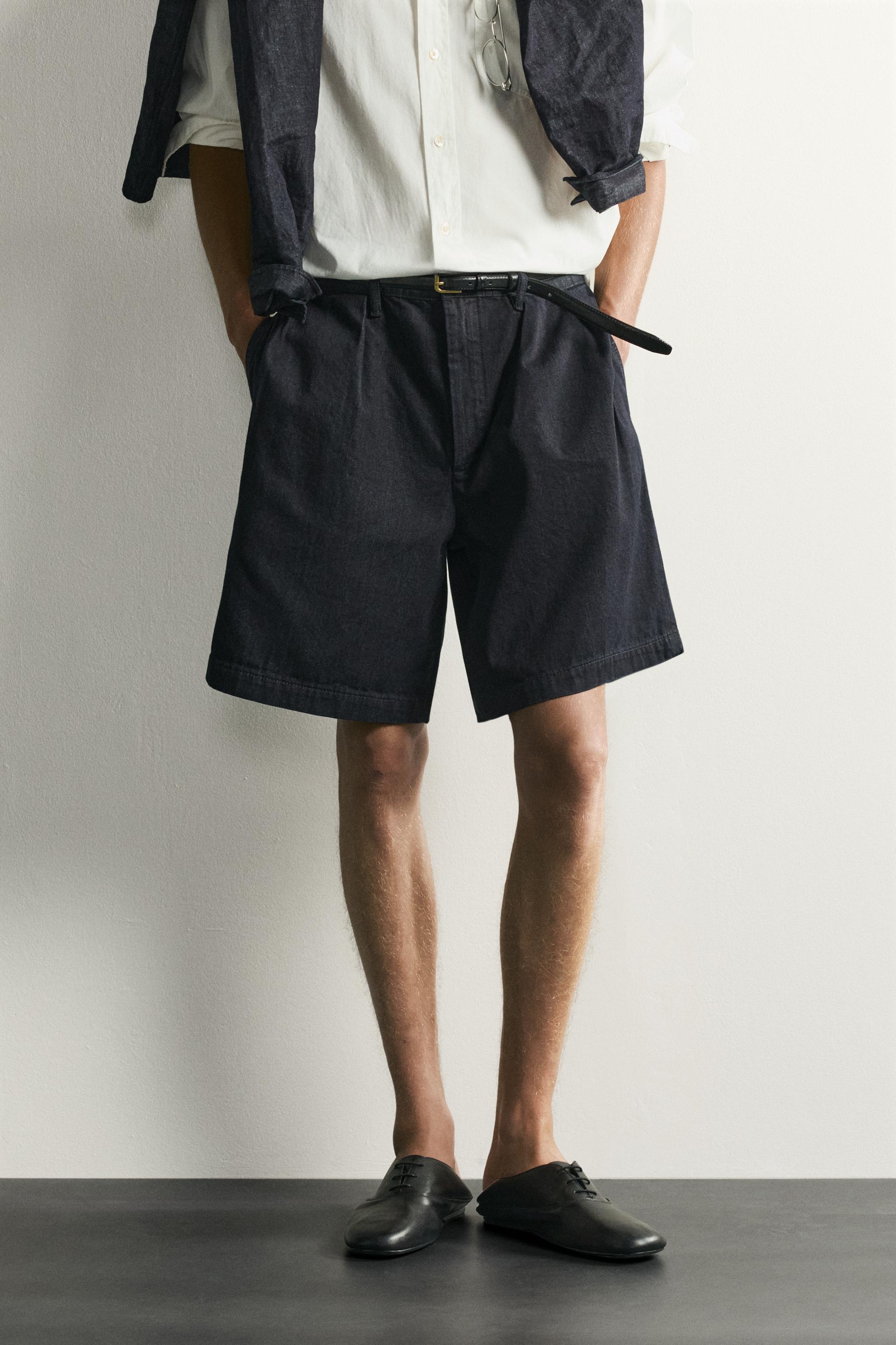 RELAXED FIT PLEATED CHINO DENIM SHORTS — Indigo