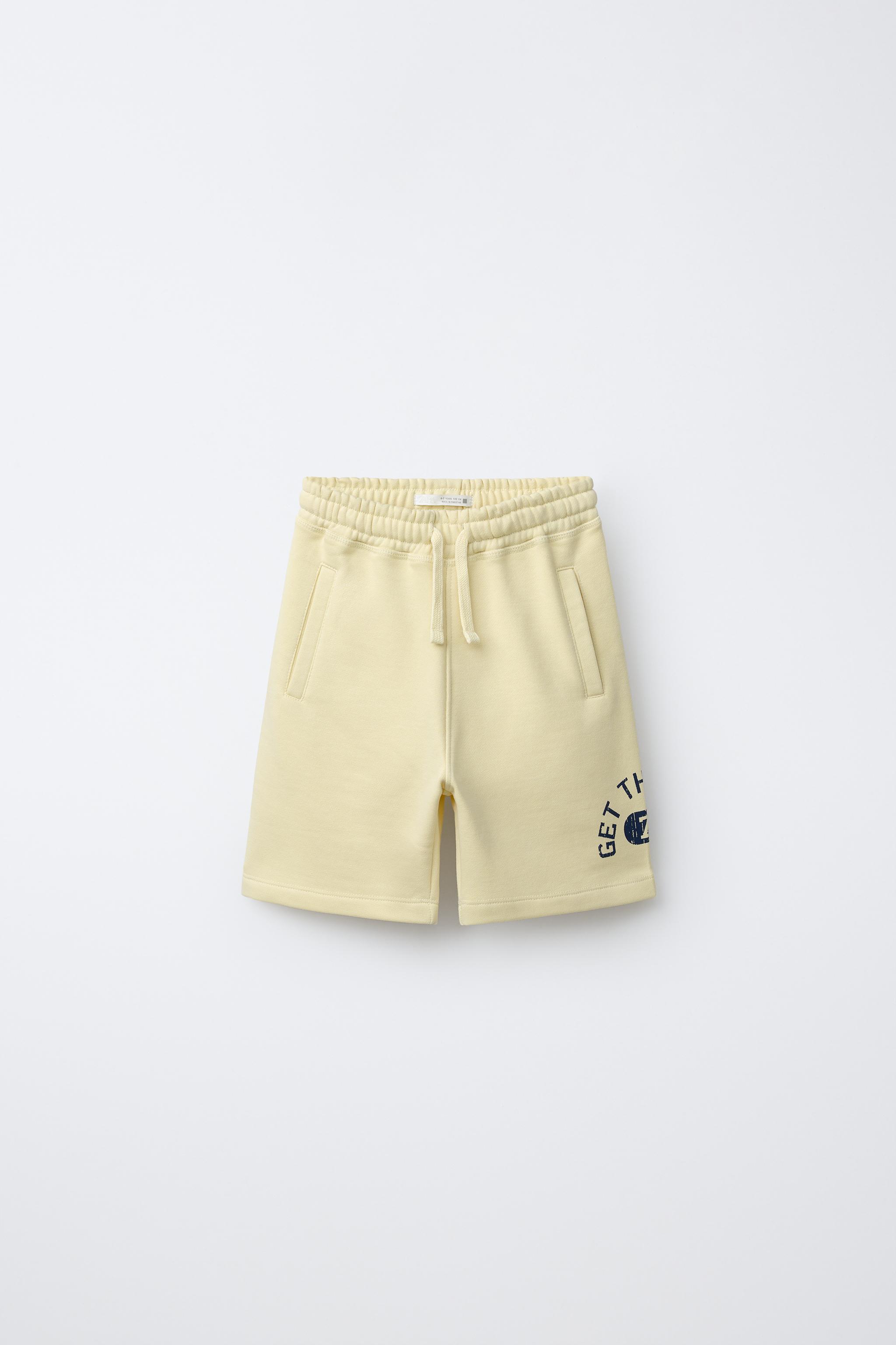 JOGGING BERMUDA SHORTS WITH SLOGAN - Yellow | ZARA Hungary
