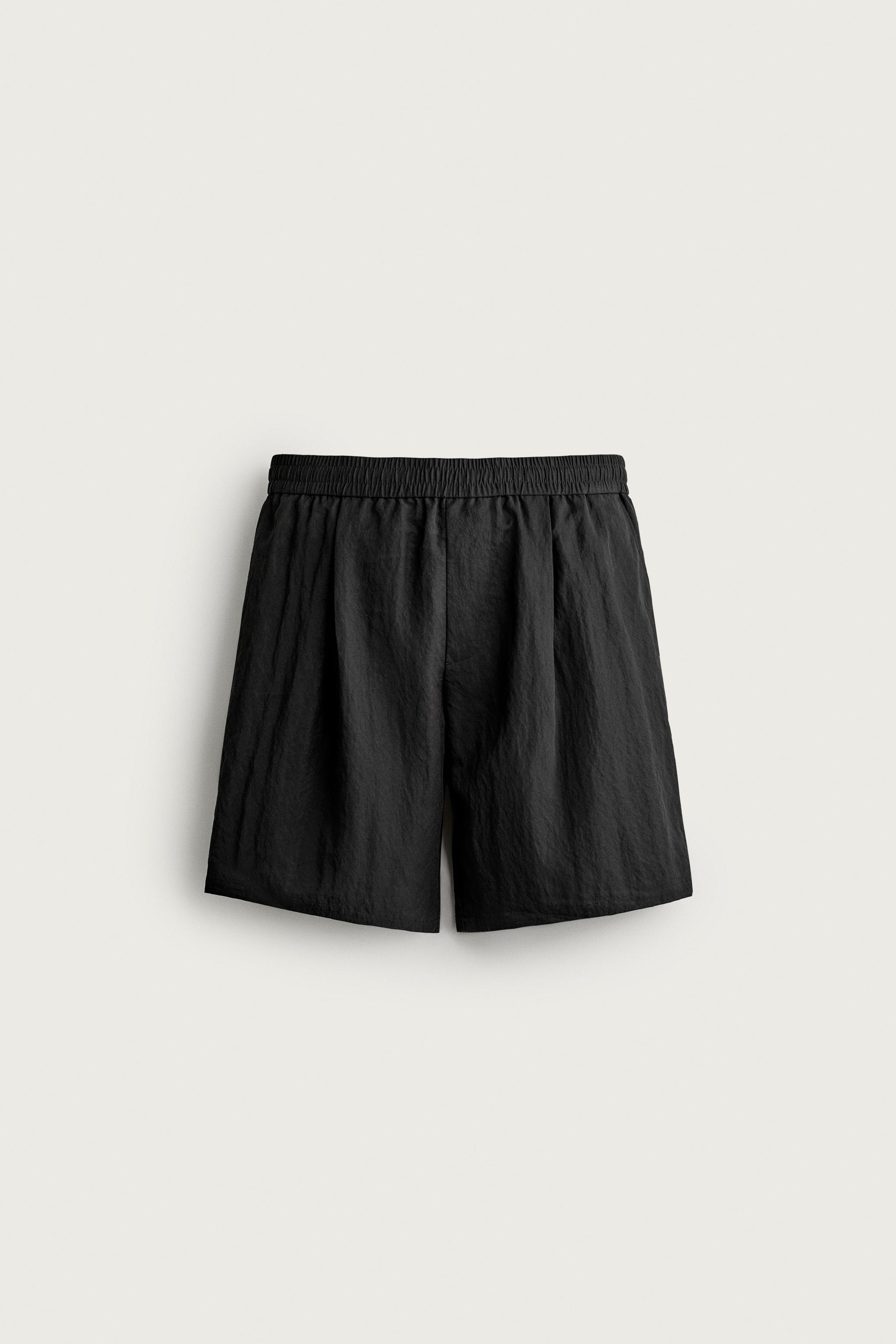 RELAXED FIT FLUID PLEATED SHORTS — Black