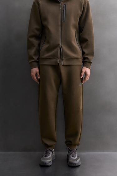 PANTALÓN TÉCNICO CREMALLERA - Marrón de Zara